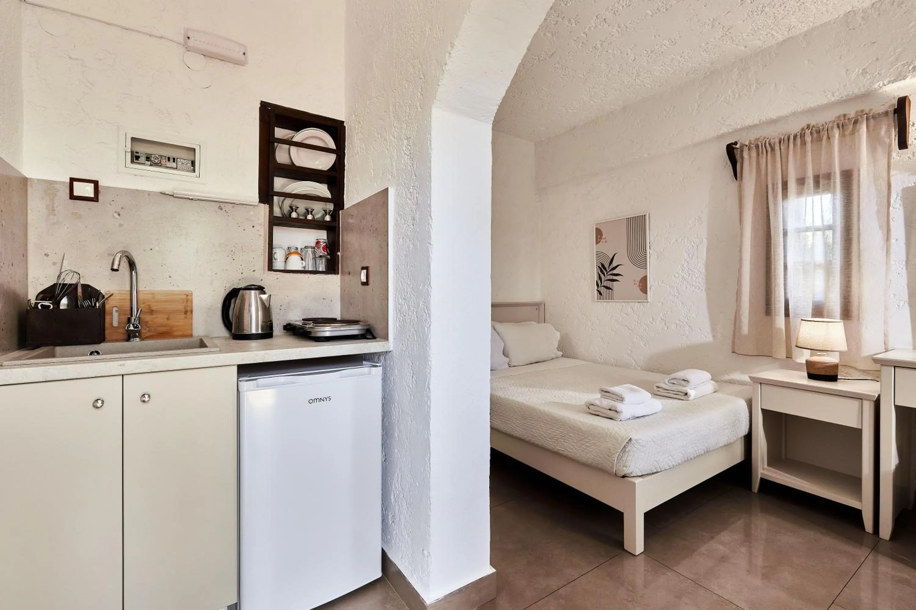 Bed in Mila Malia Studios Hotel