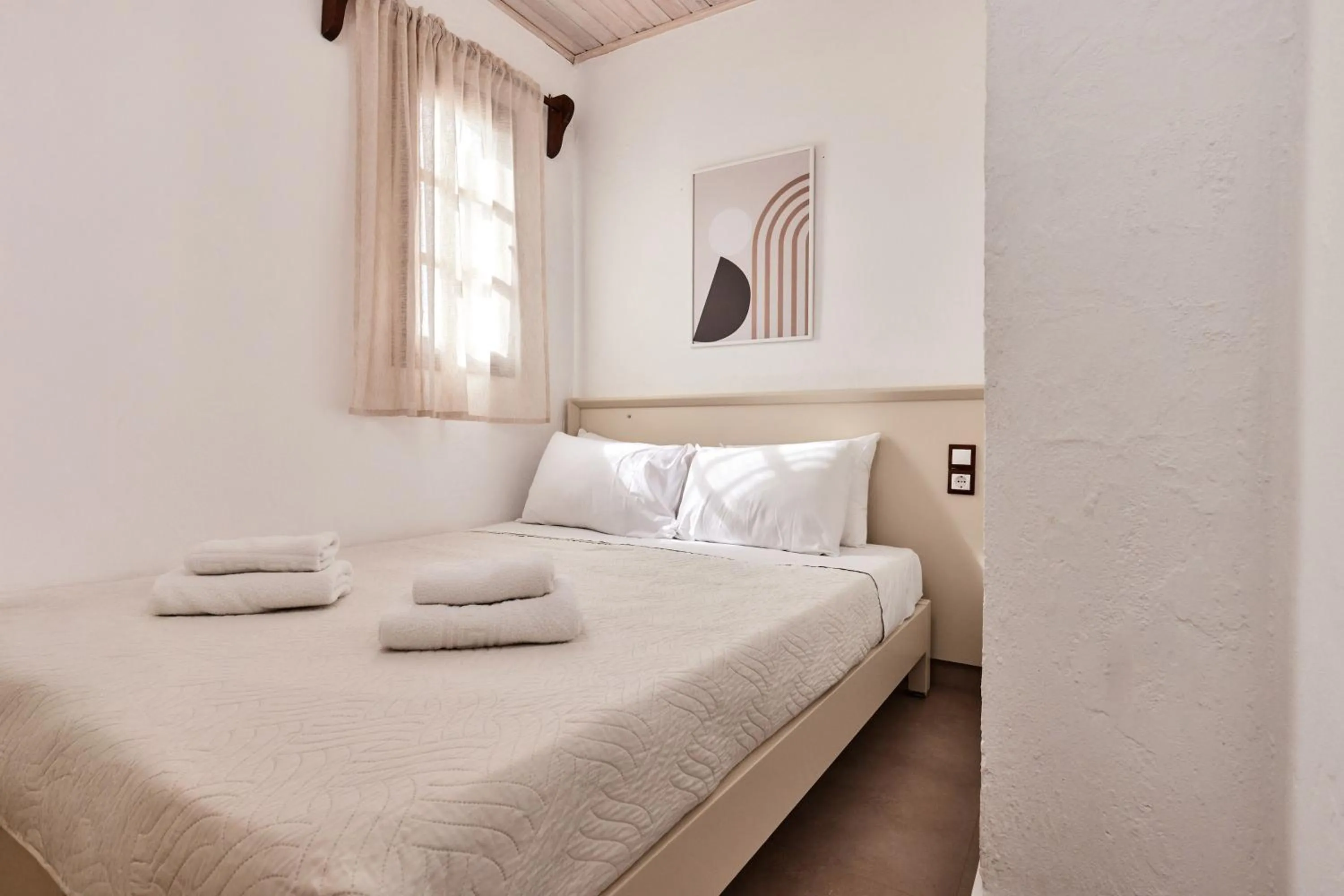 Bed in Mila Malia Studios Hotel