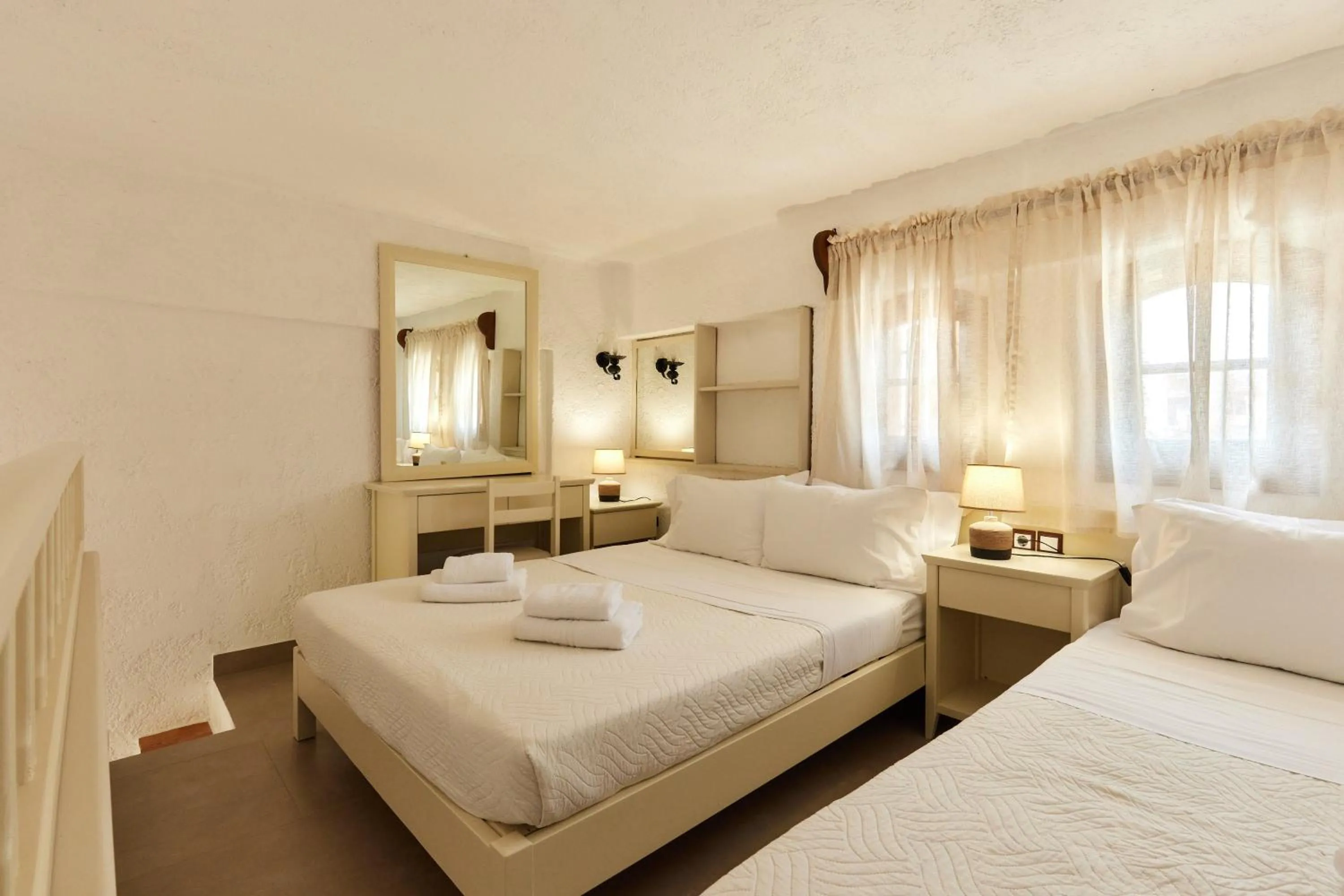 Bed in Mila Malia Studios Hotel