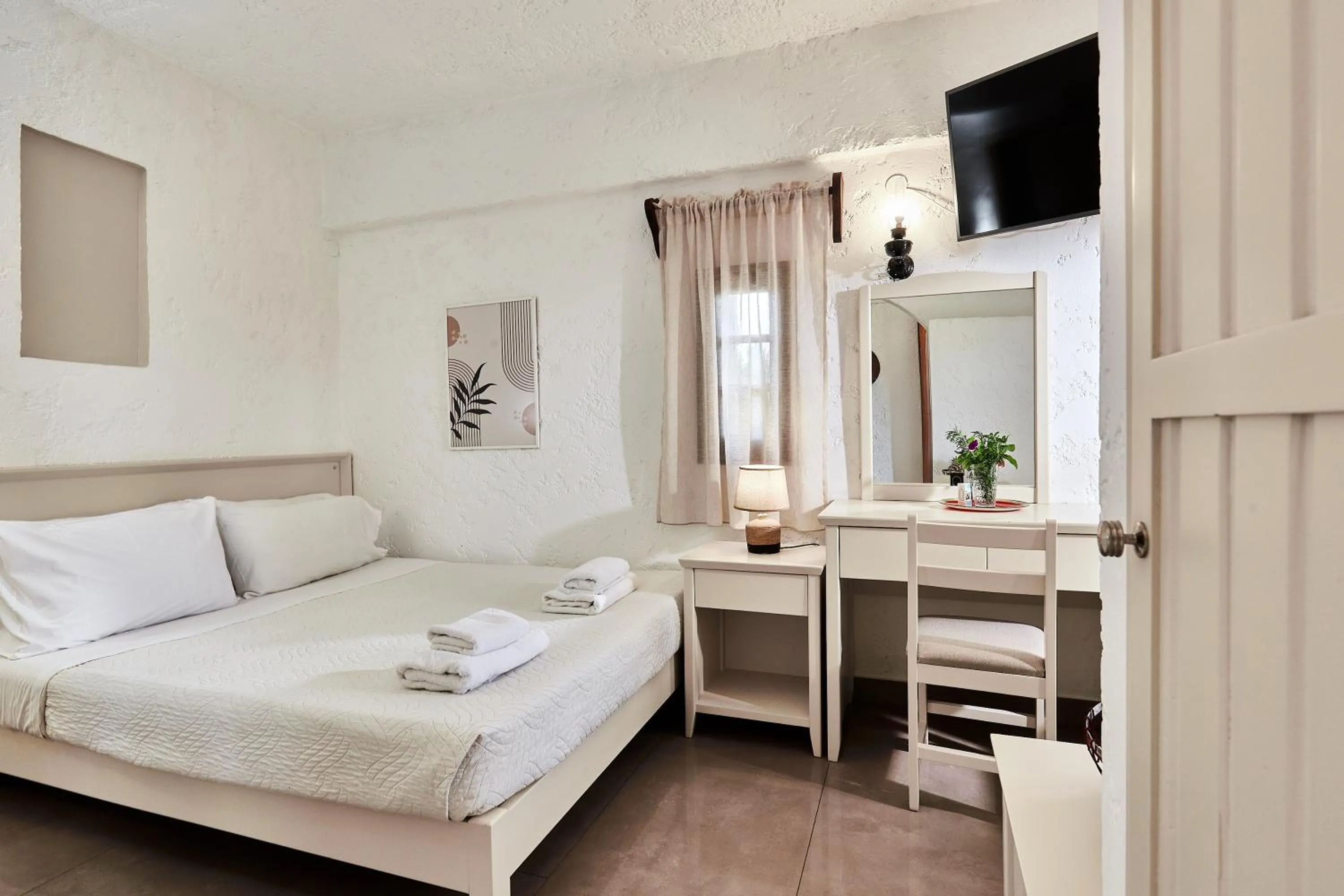 Bed in Mila Malia Studios Hotel