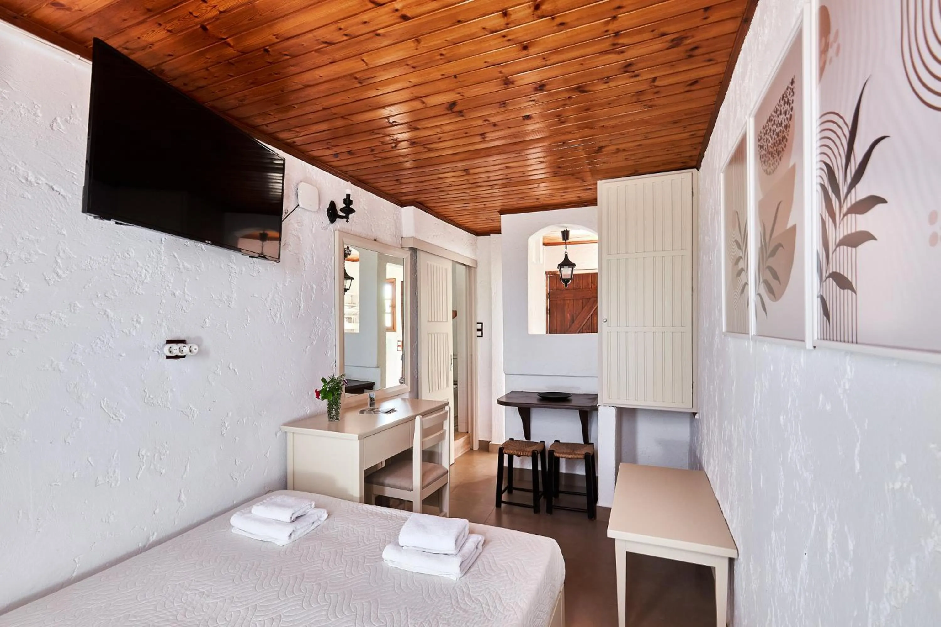 Bed in Mila Malia Studios Hotel