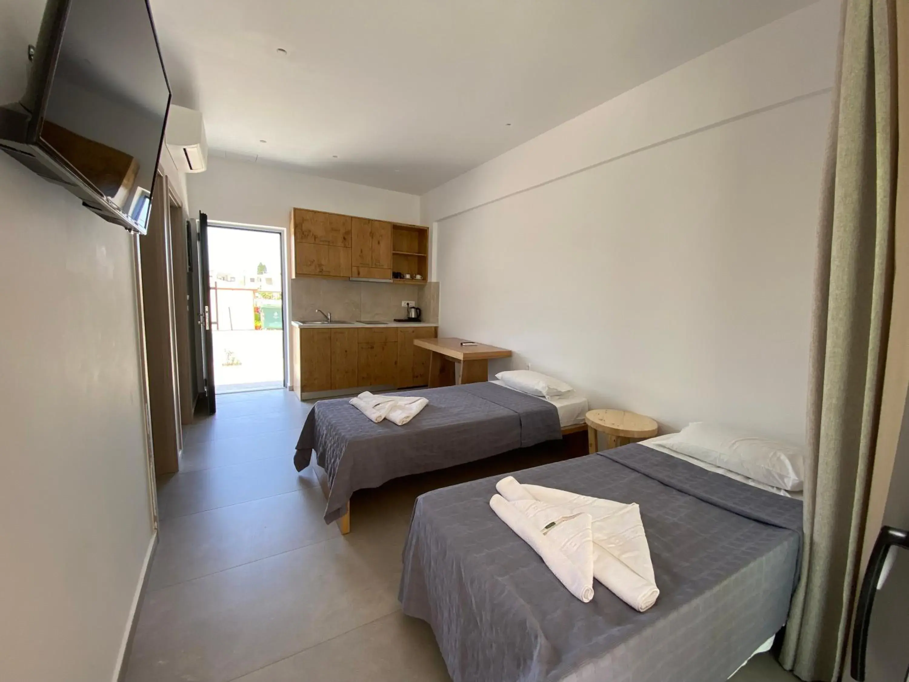 Living room, Bed in Blue Aegean Hotel & Suites Living room, Bed in Blue Aegean Hotel & Suites