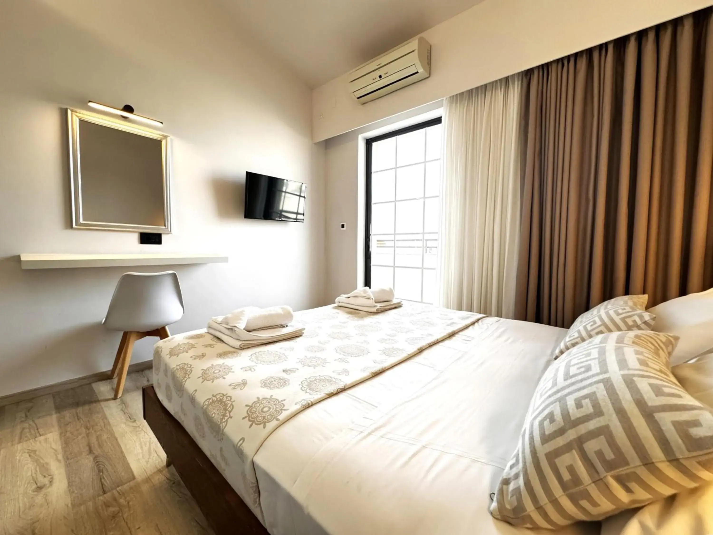 Bed in Elina Hotel Apartments Bed in Elina Hotel Apartments