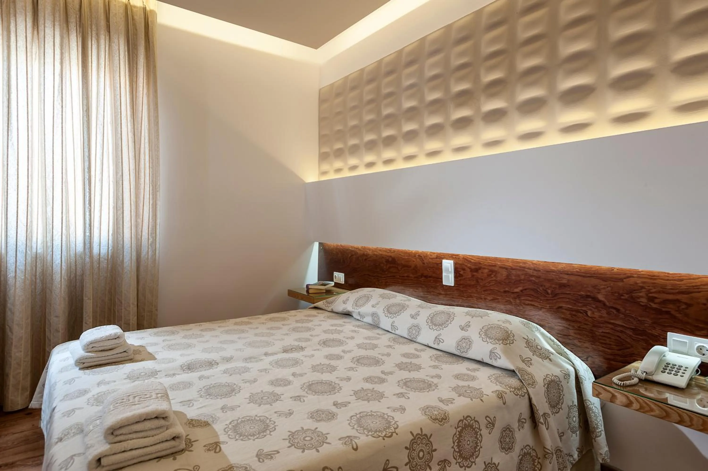 Bed in Elina Hotel Apartments