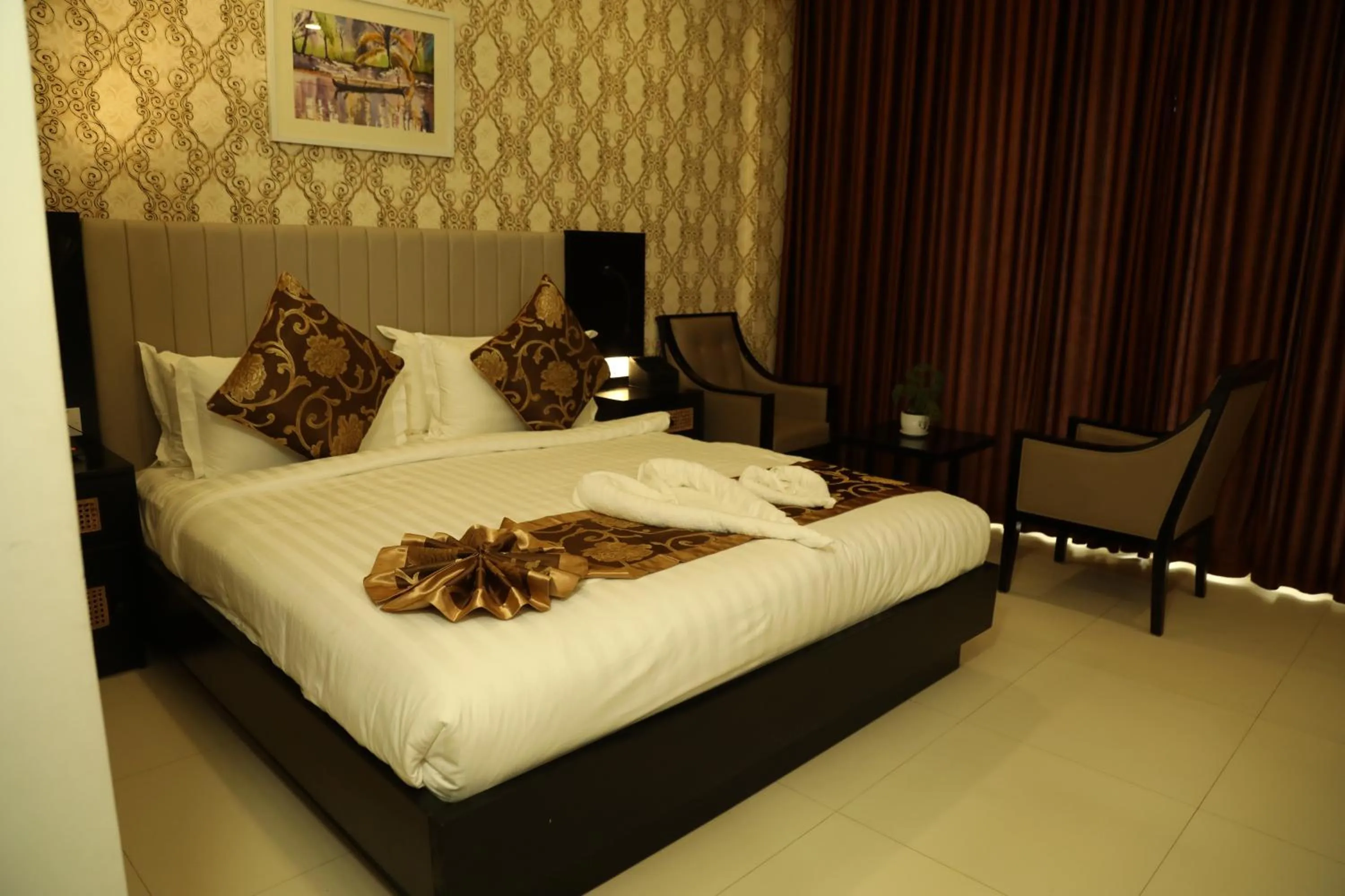 Bed in MARIYALAYAM MUNROE ISLAND RESIDENCY