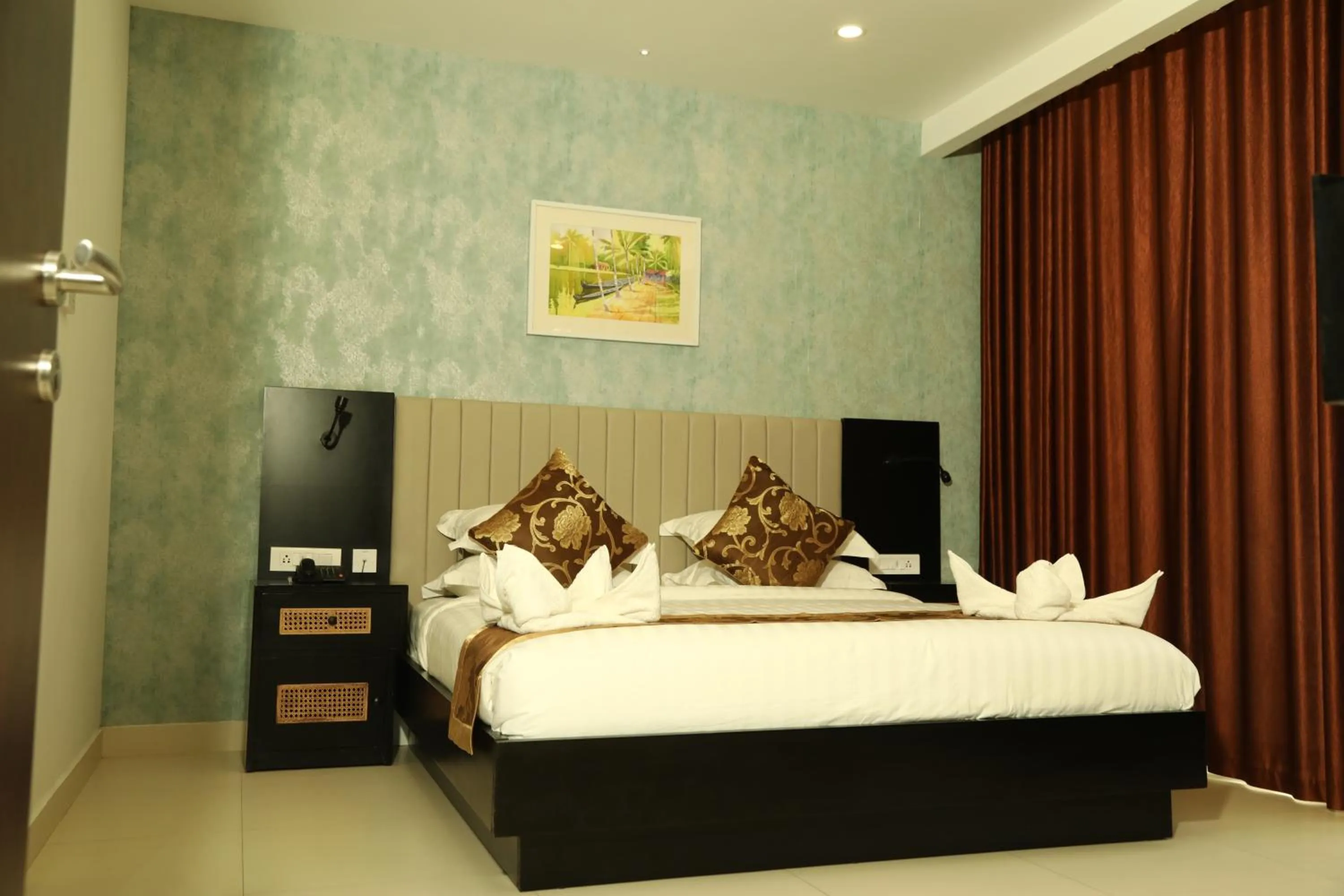 Bed in MARIYALAYAM MUNROE ISLAND RESIDENCY