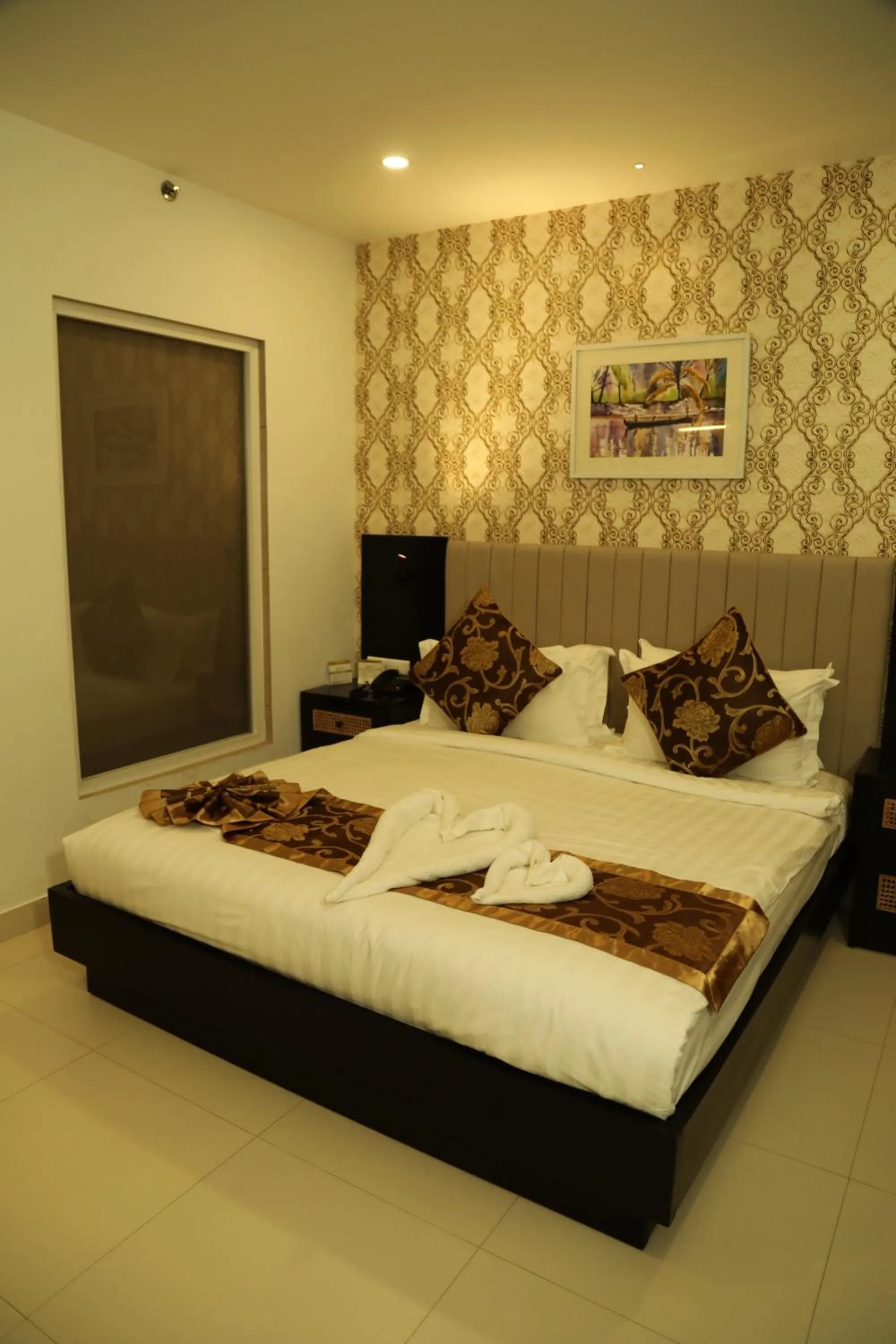 Bed in MARIYALAYAM MUNROE ISLAND RESIDENCY