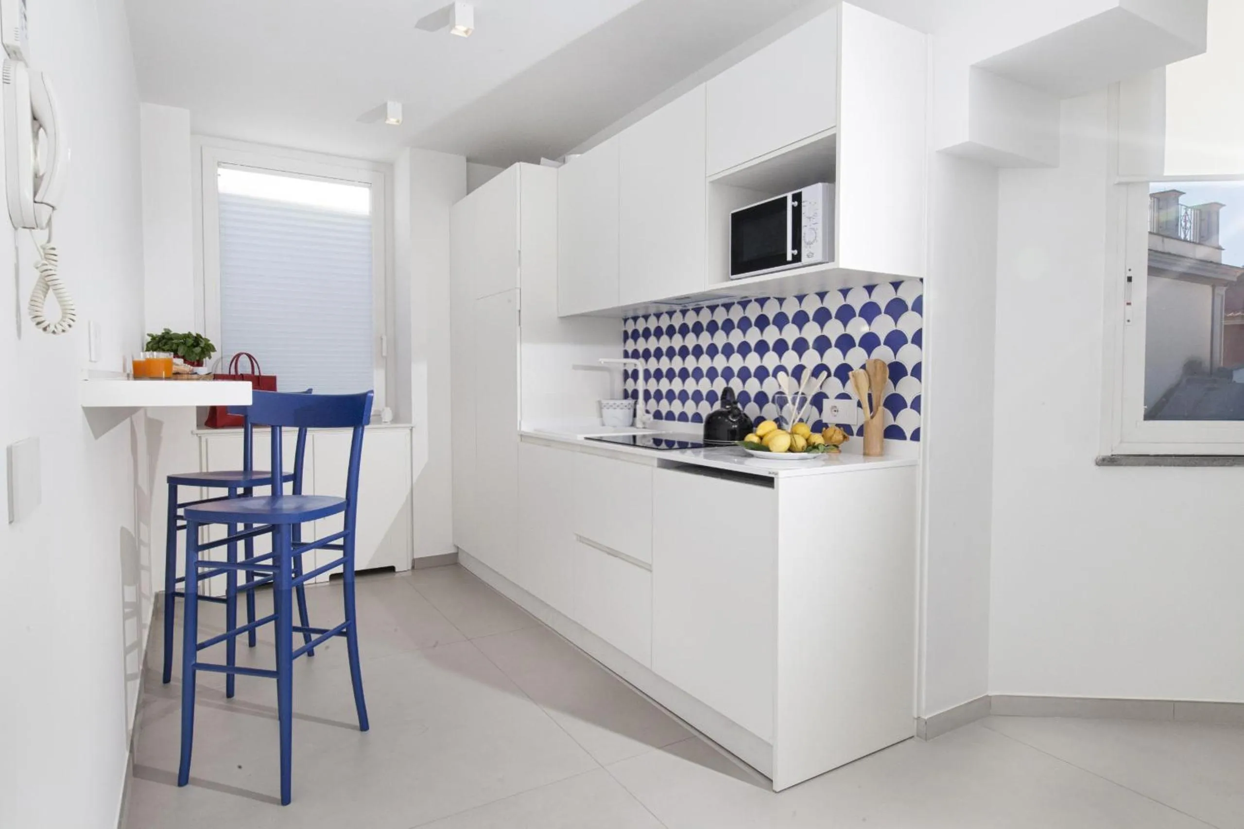 Kitchen or kitchenette in AMORE RENTALS - Appartamento Luis 2 11