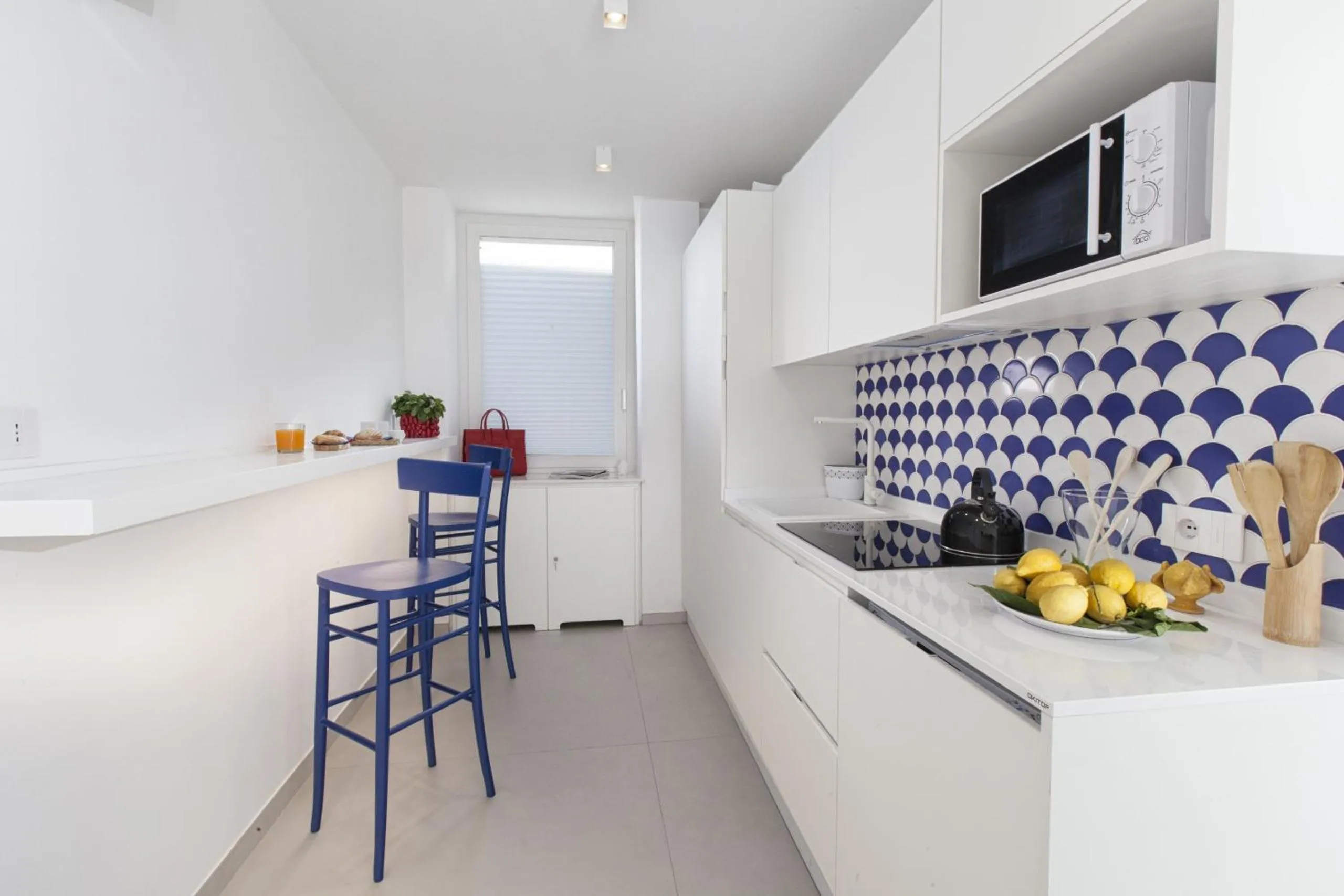 Kitchen or kitchenette in AMORE RENTALS - Appartamento Luis 2 11