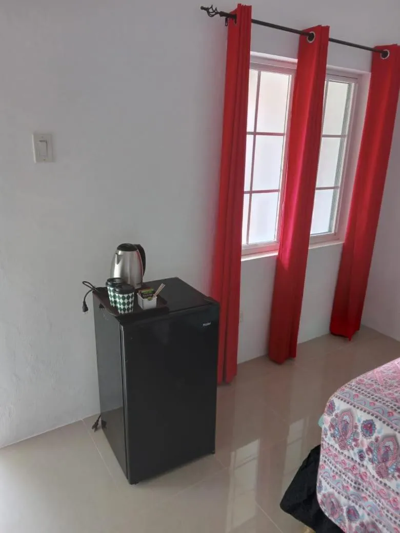 Coffee/tea facilities, Bed in Comfy Guest Rooms