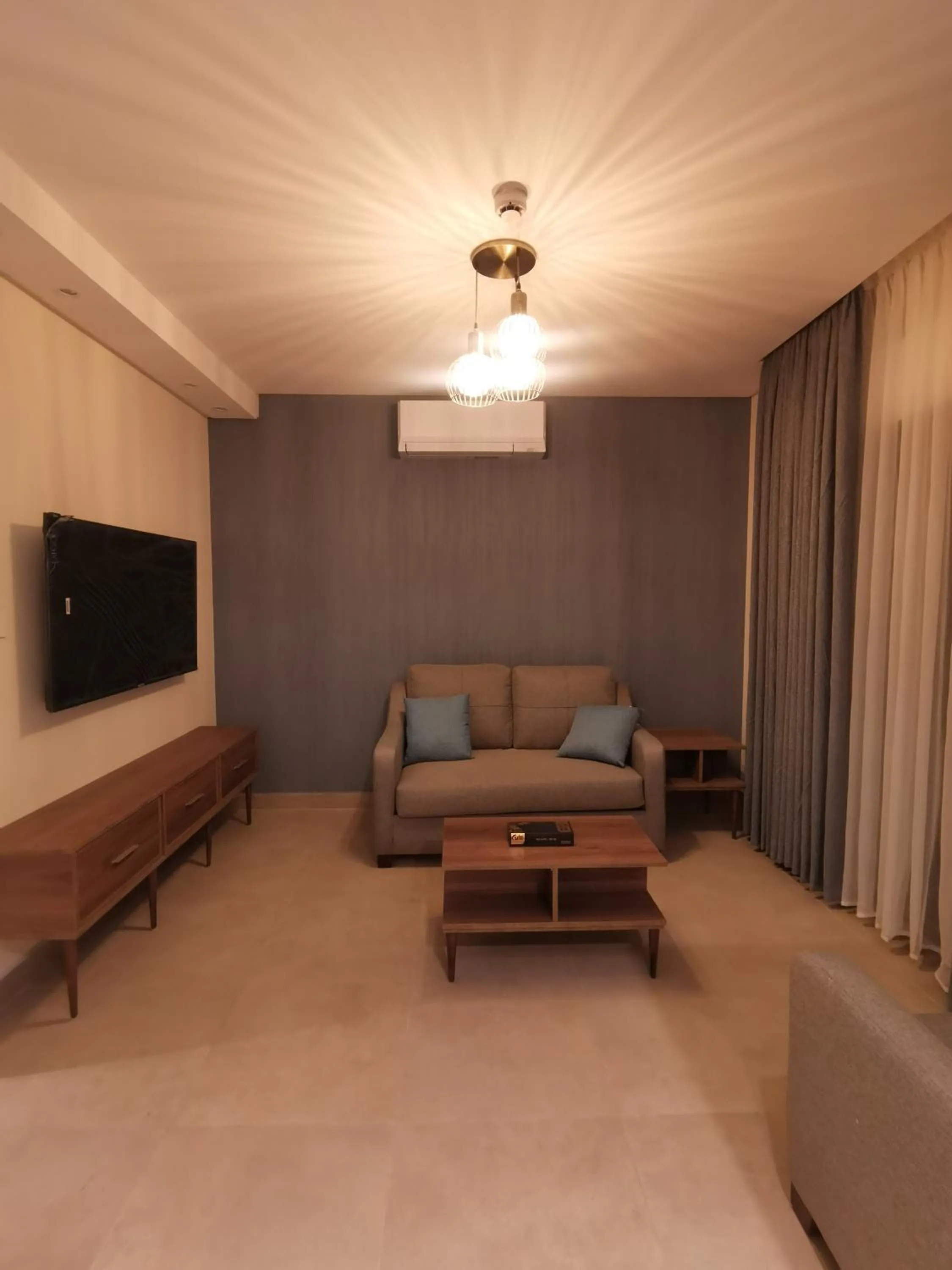 Communal lounge/ TV room in Dara apartment hotel