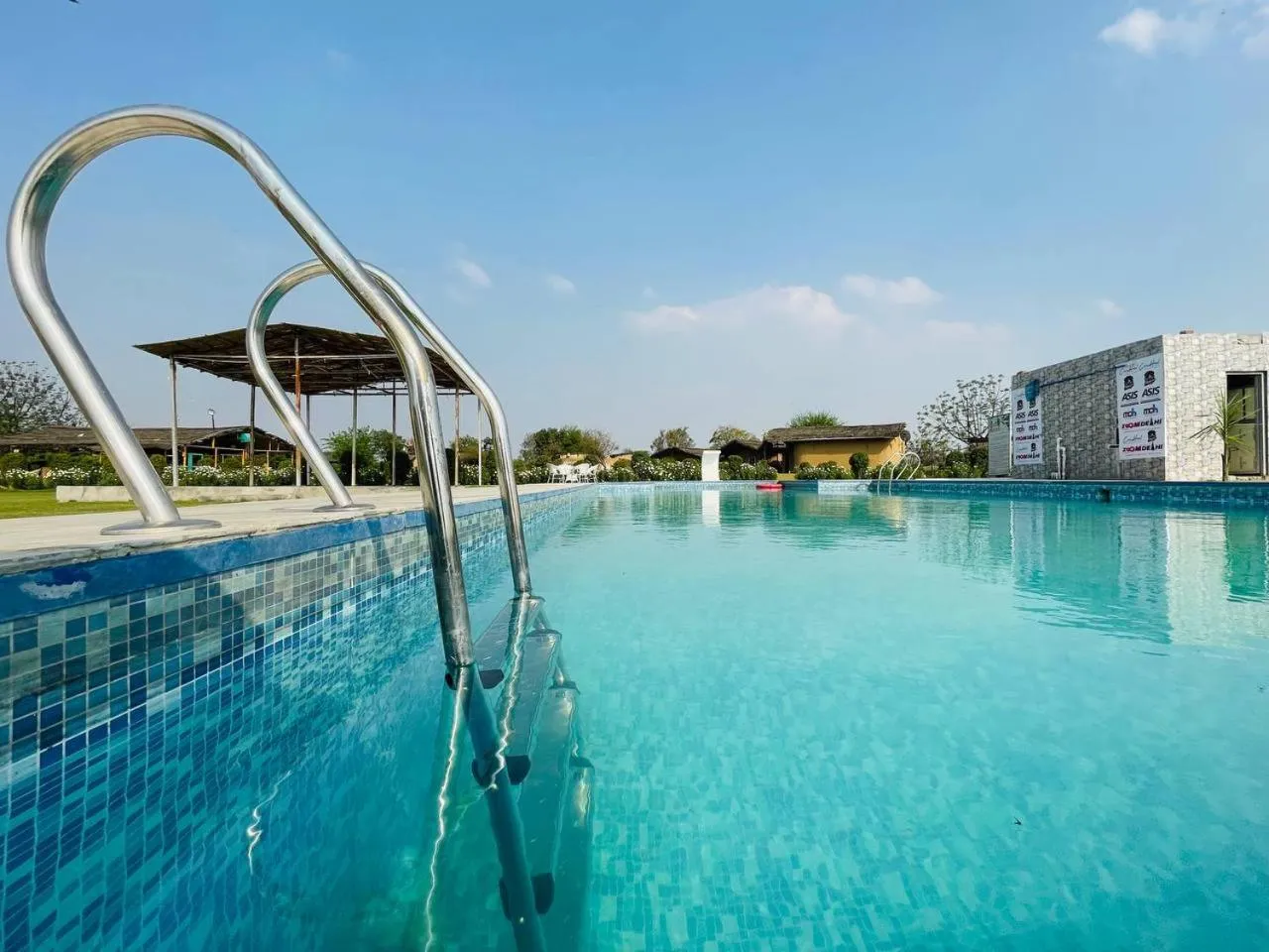 Swimming pool in Arise Ethnic Village Resort - Manesar Bilaspur