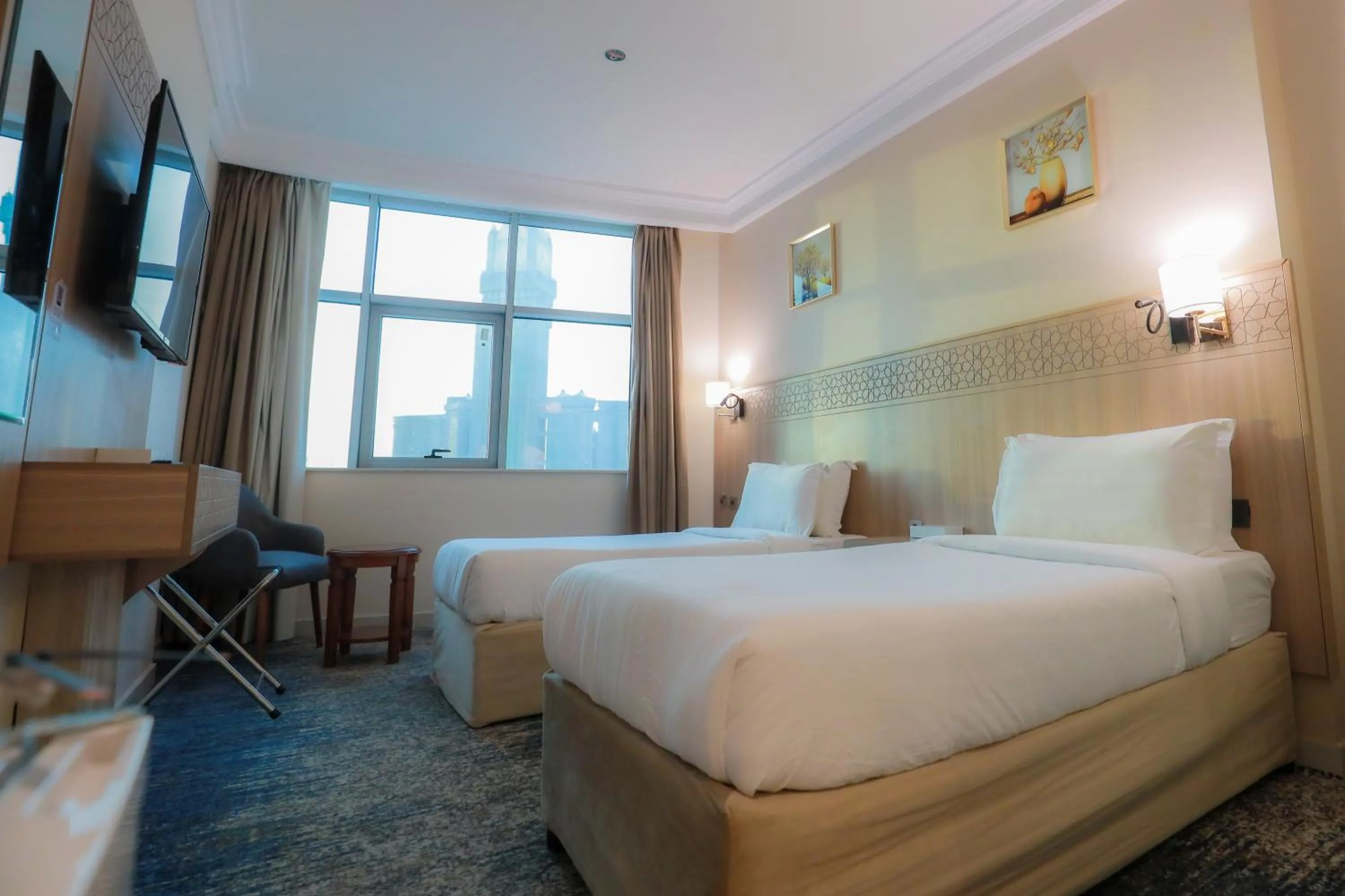 Bed in Nawazi Towers Hotel