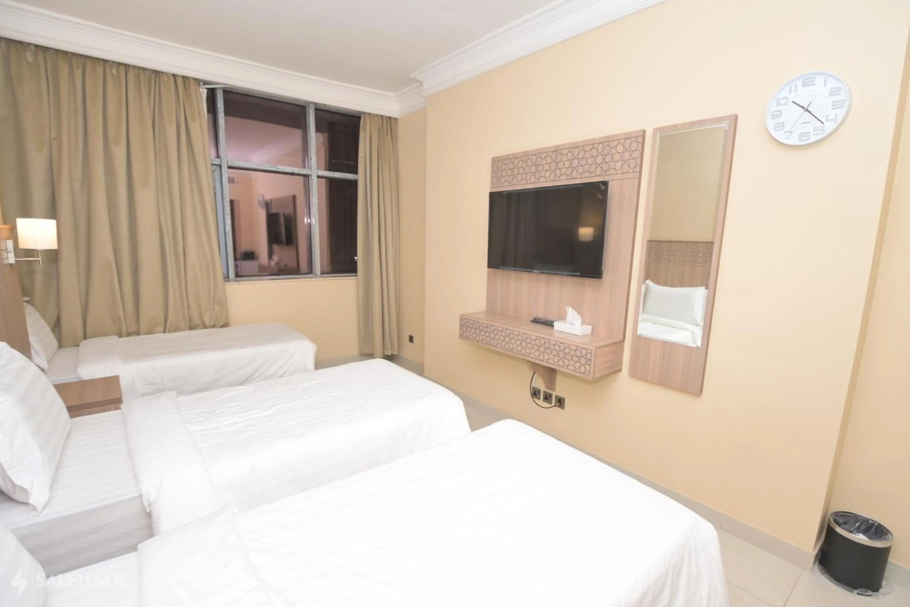 Bed in Nawazi Towers Hotel