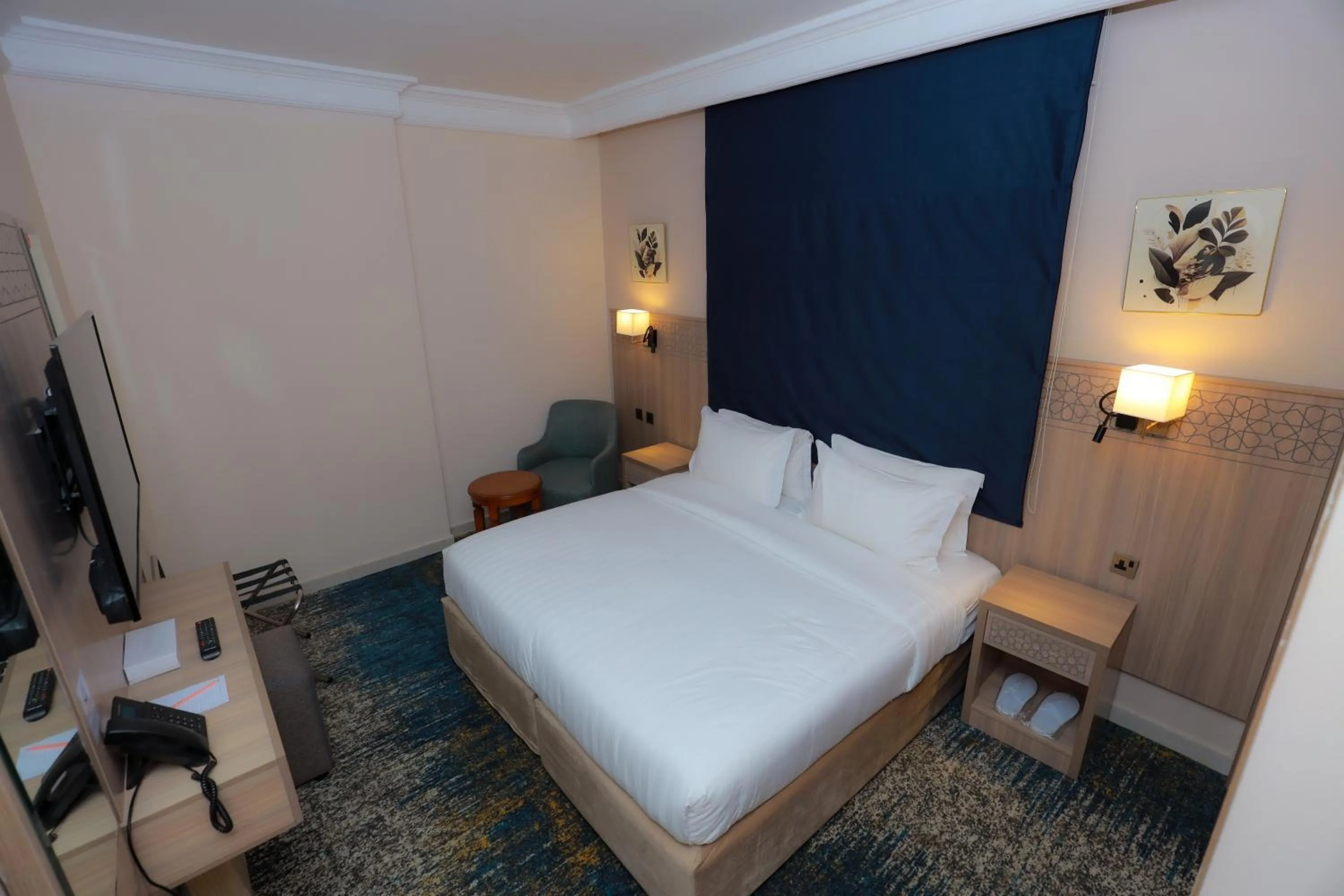 Bed in Nawazi Towers Hotel