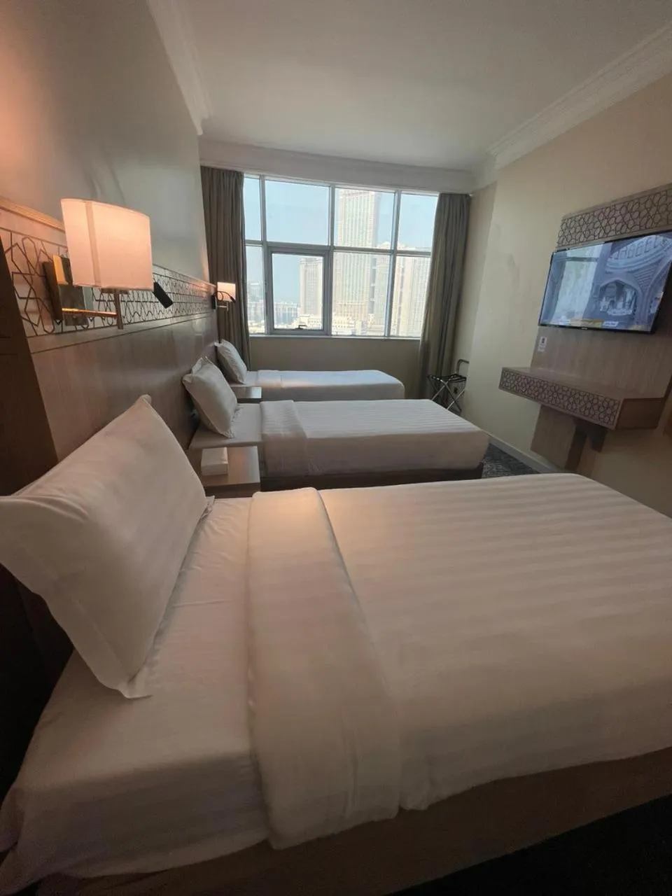 Bed in Nawazi Towers Hotel