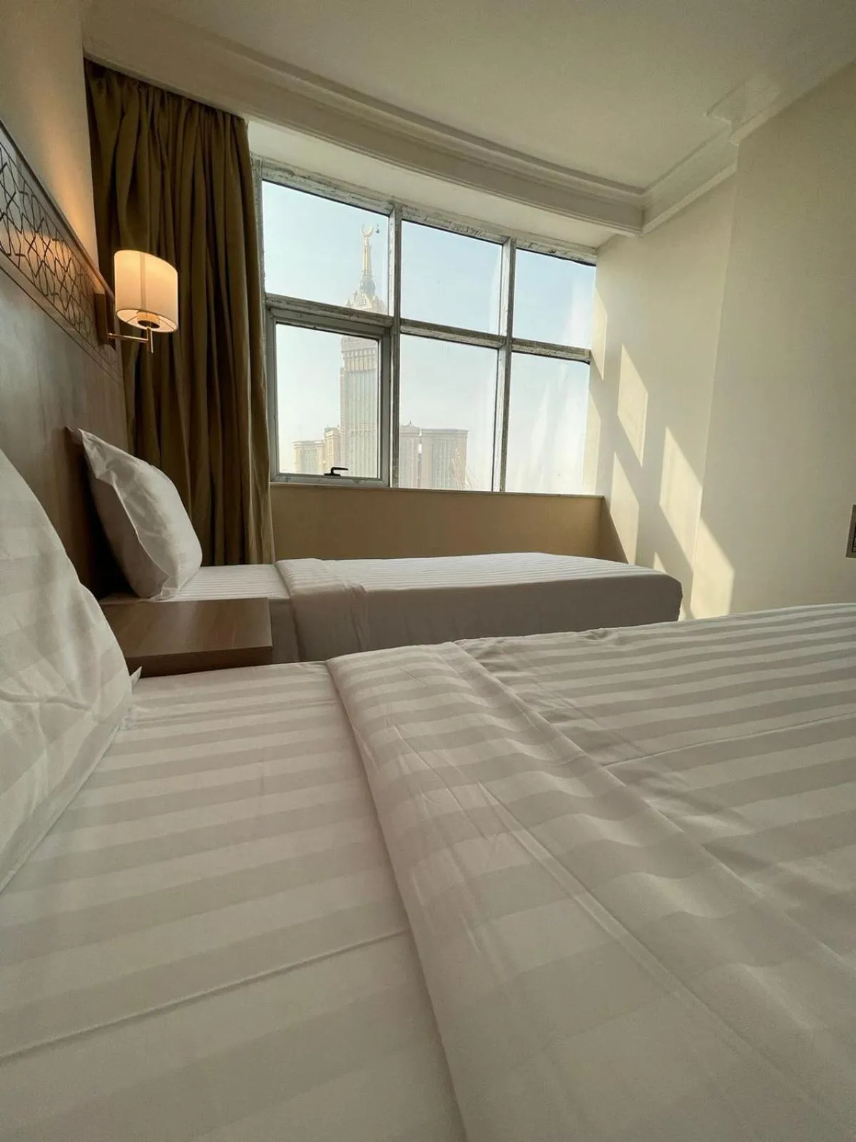Bed in Nawazi Towers Hotel