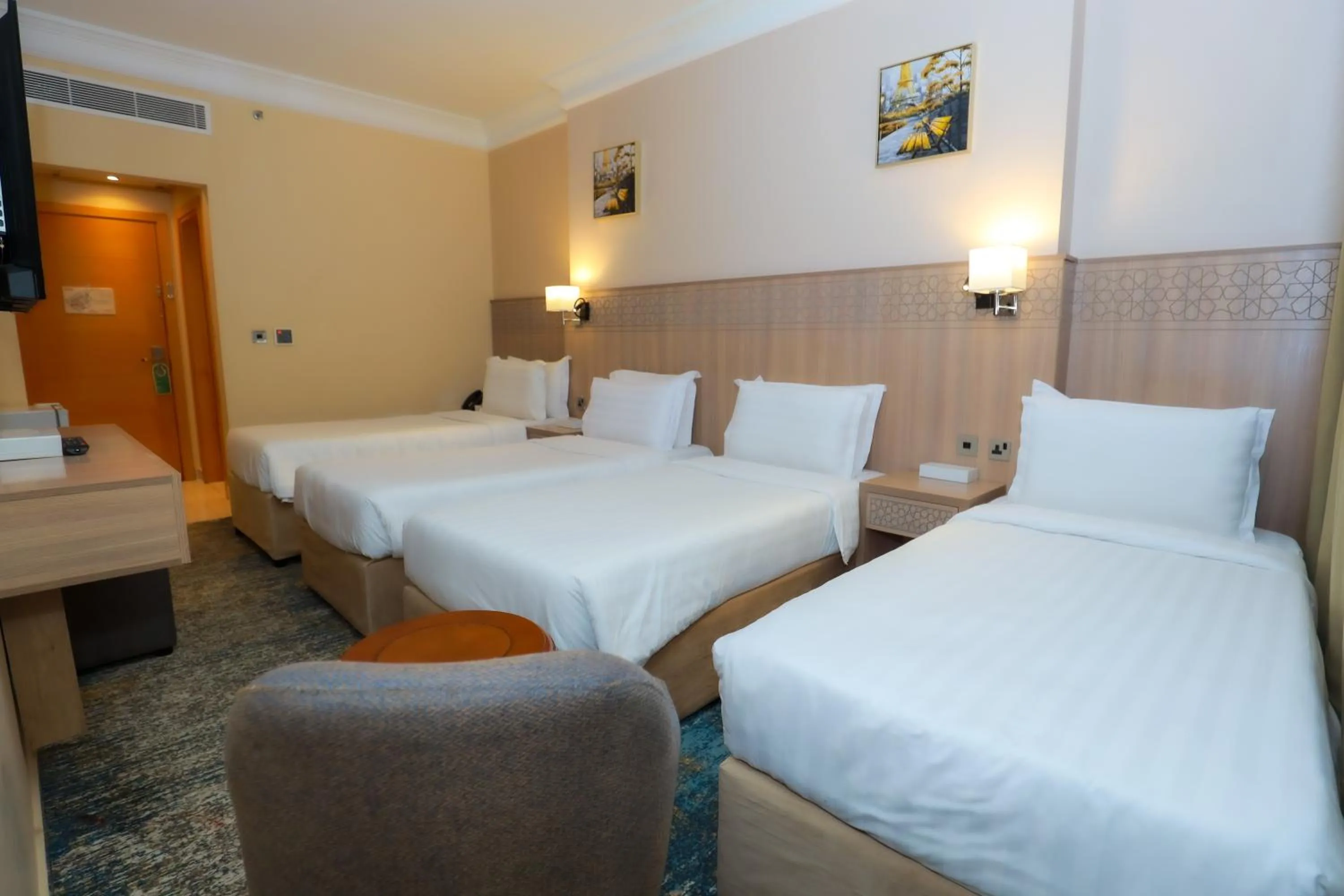 Bed in Nawazi Towers Hotel