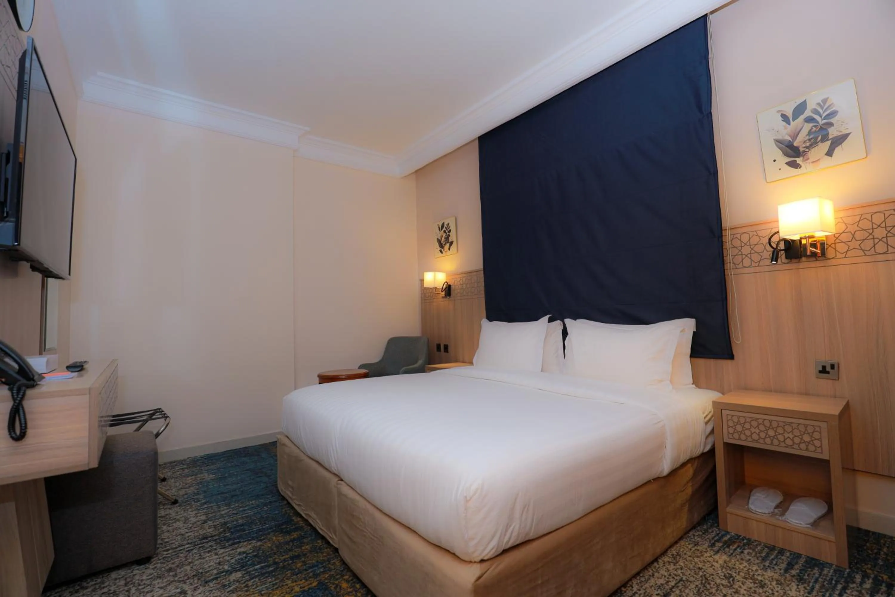 Bed in Nawazi Towers Hotel