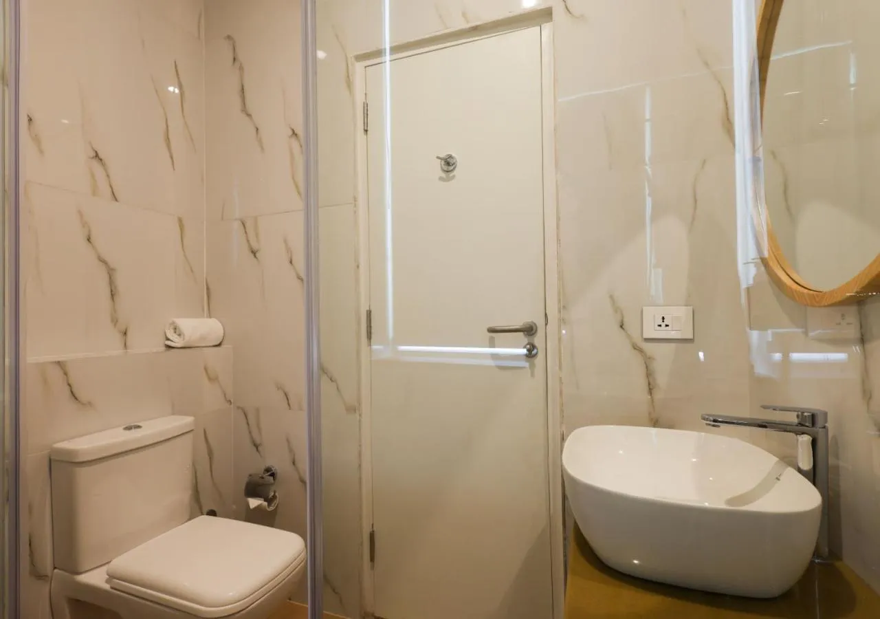 Bathroom in Bloom Hotel - Golf Course Road, Sector 43