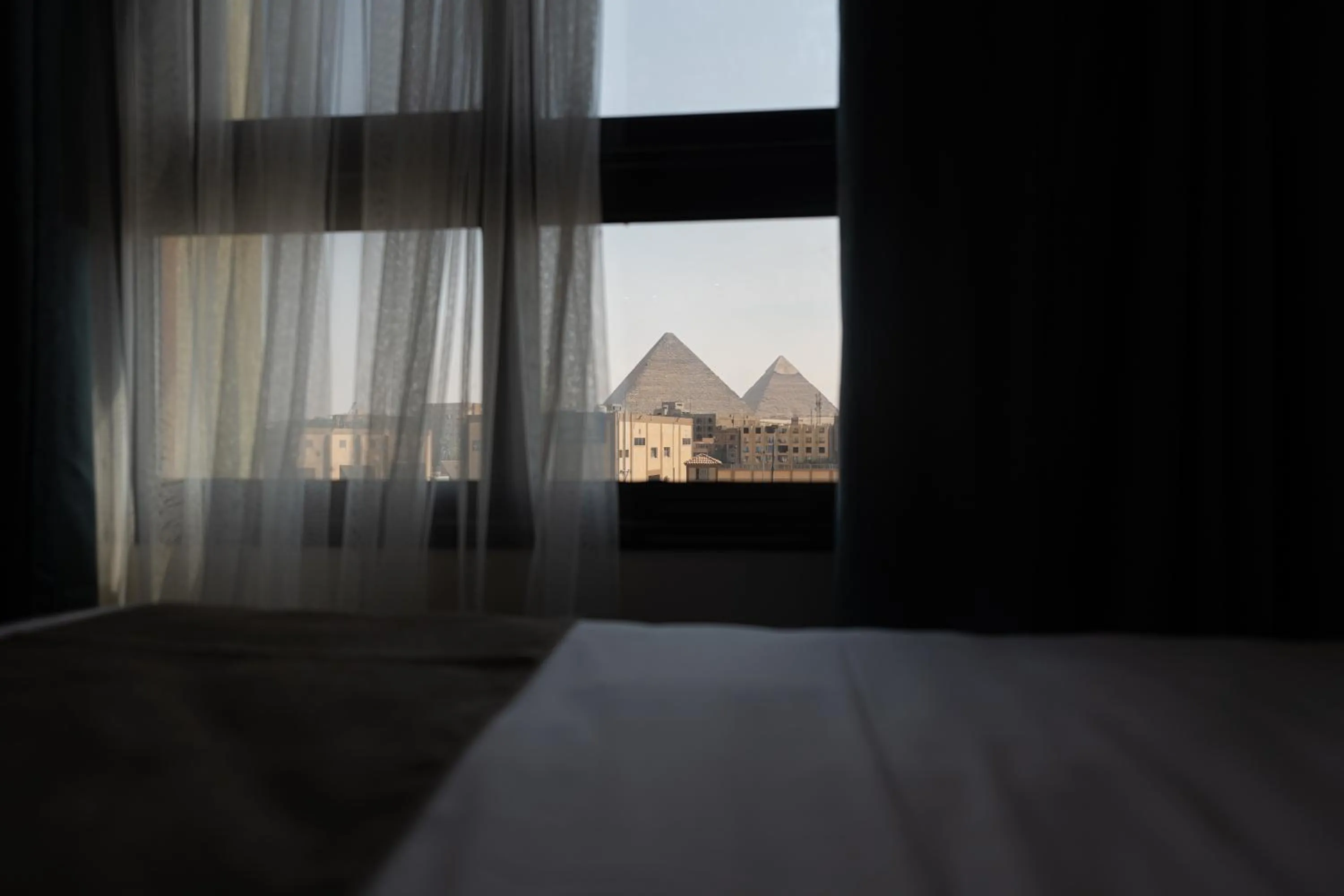 View (from property/room), Bed in Pyramid Front Hotel