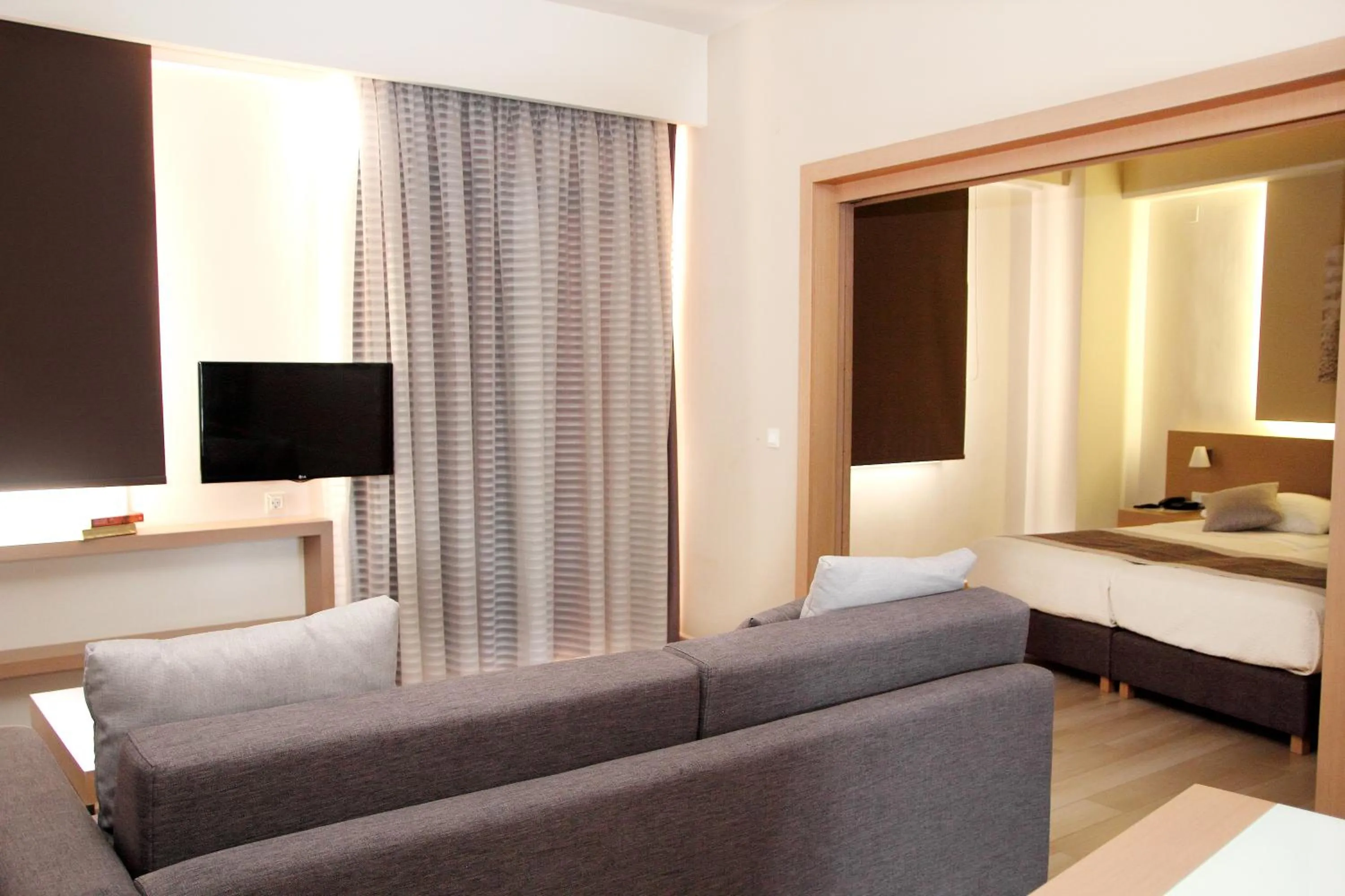 Living room, Bed in Renieris Hotel