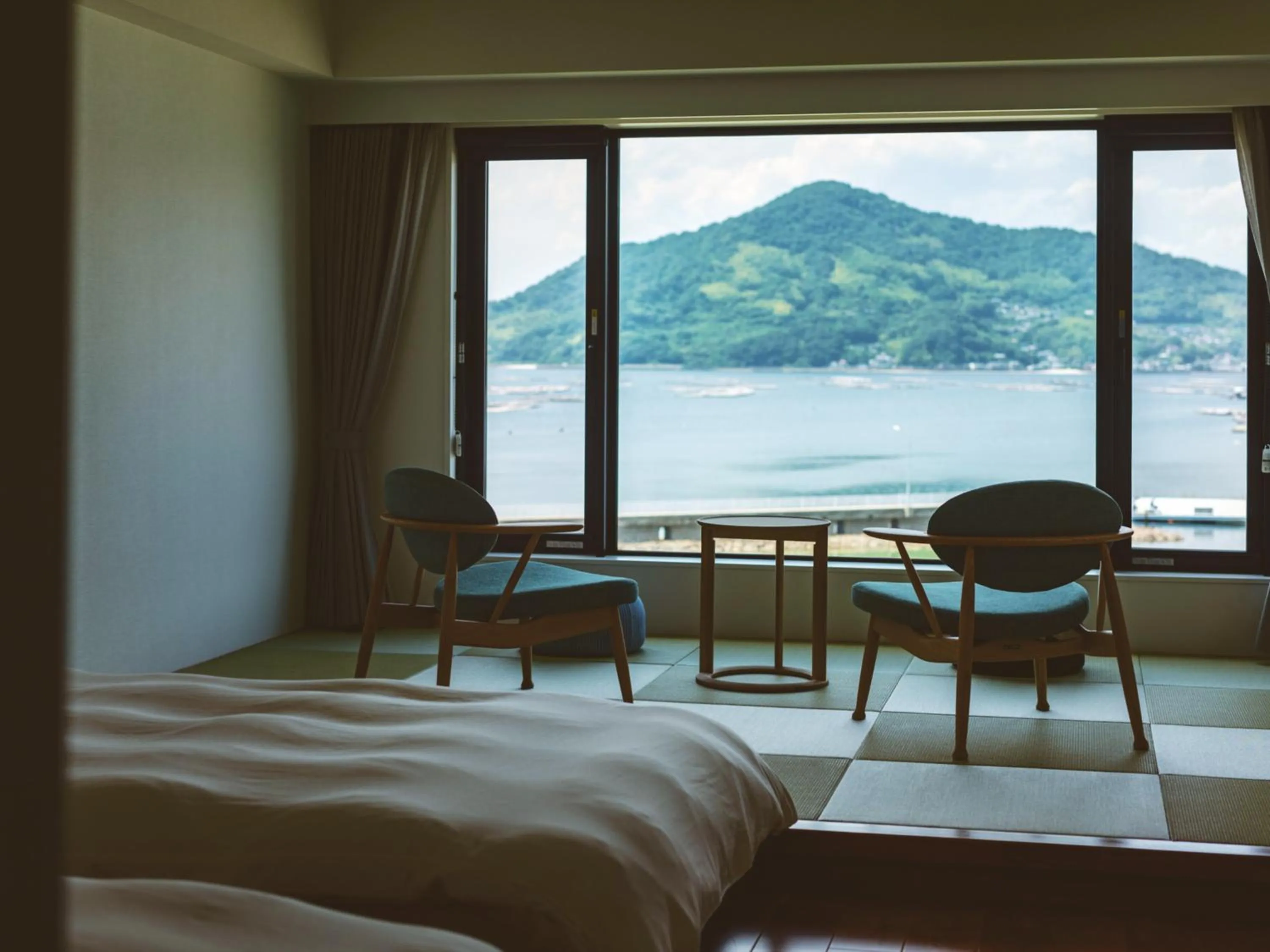 Photo of the whole room, Bed in Etajimasou Hotel & SPA Hiroshima