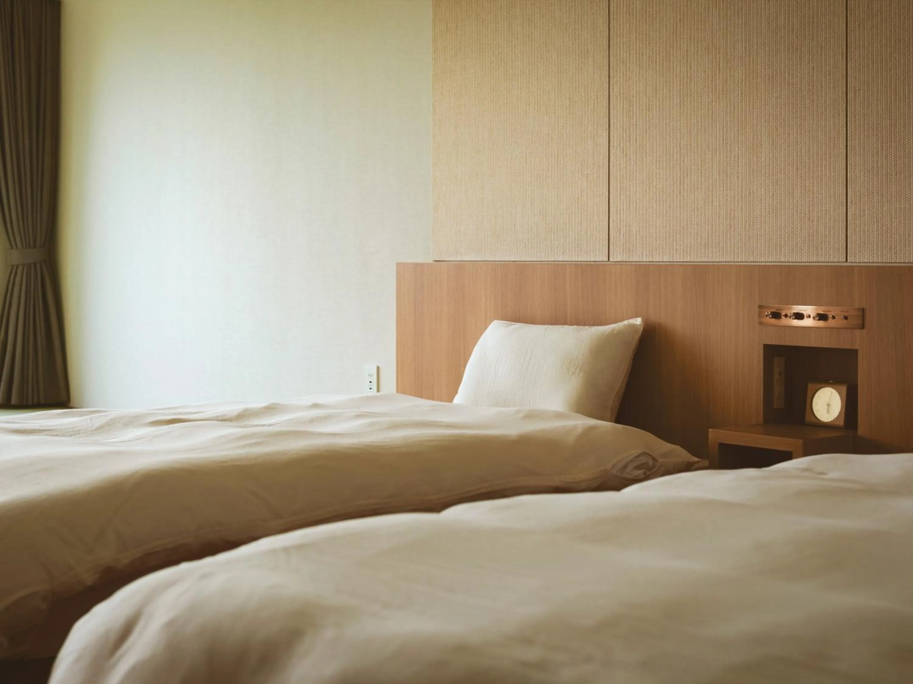 Photo of the whole room, Bed in Etajimasou Hotel & SPA Hiroshima