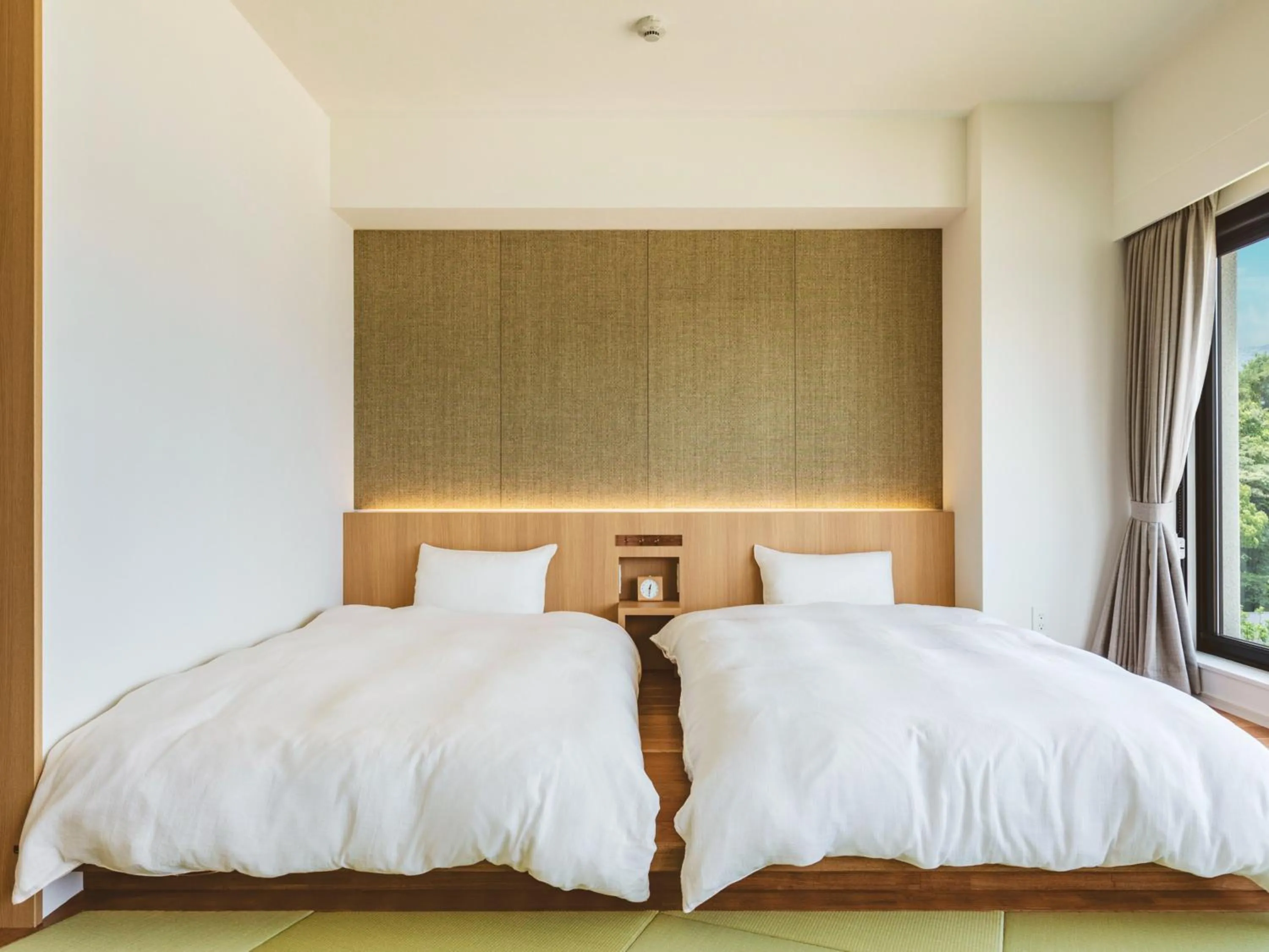 Photo of the whole room, Bed in Etajimasou Hotel & SPA Hiroshima