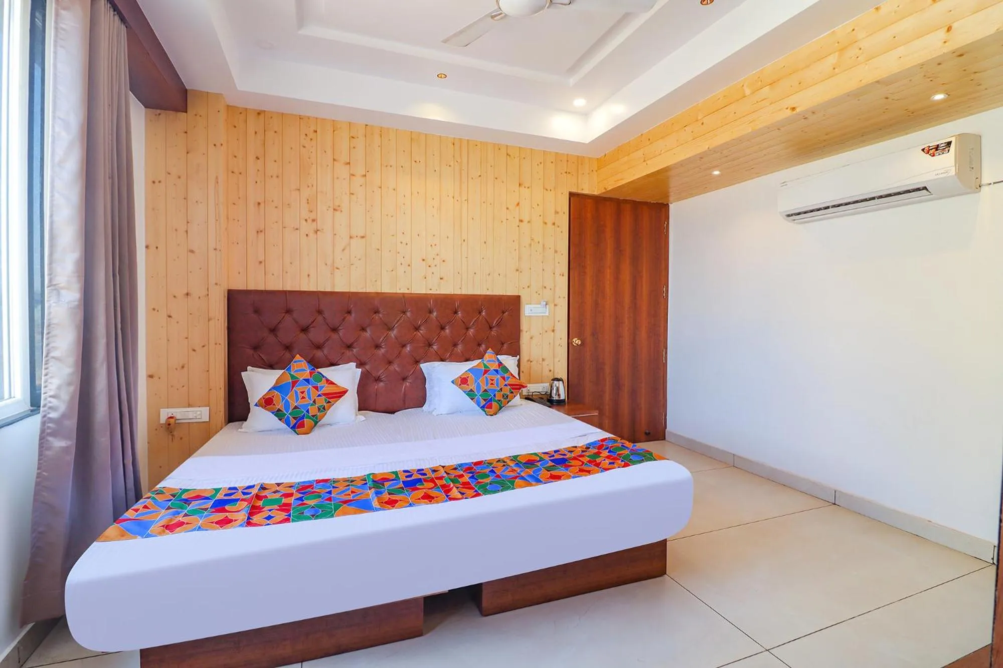 Bed in FabHotel Grand Arya
