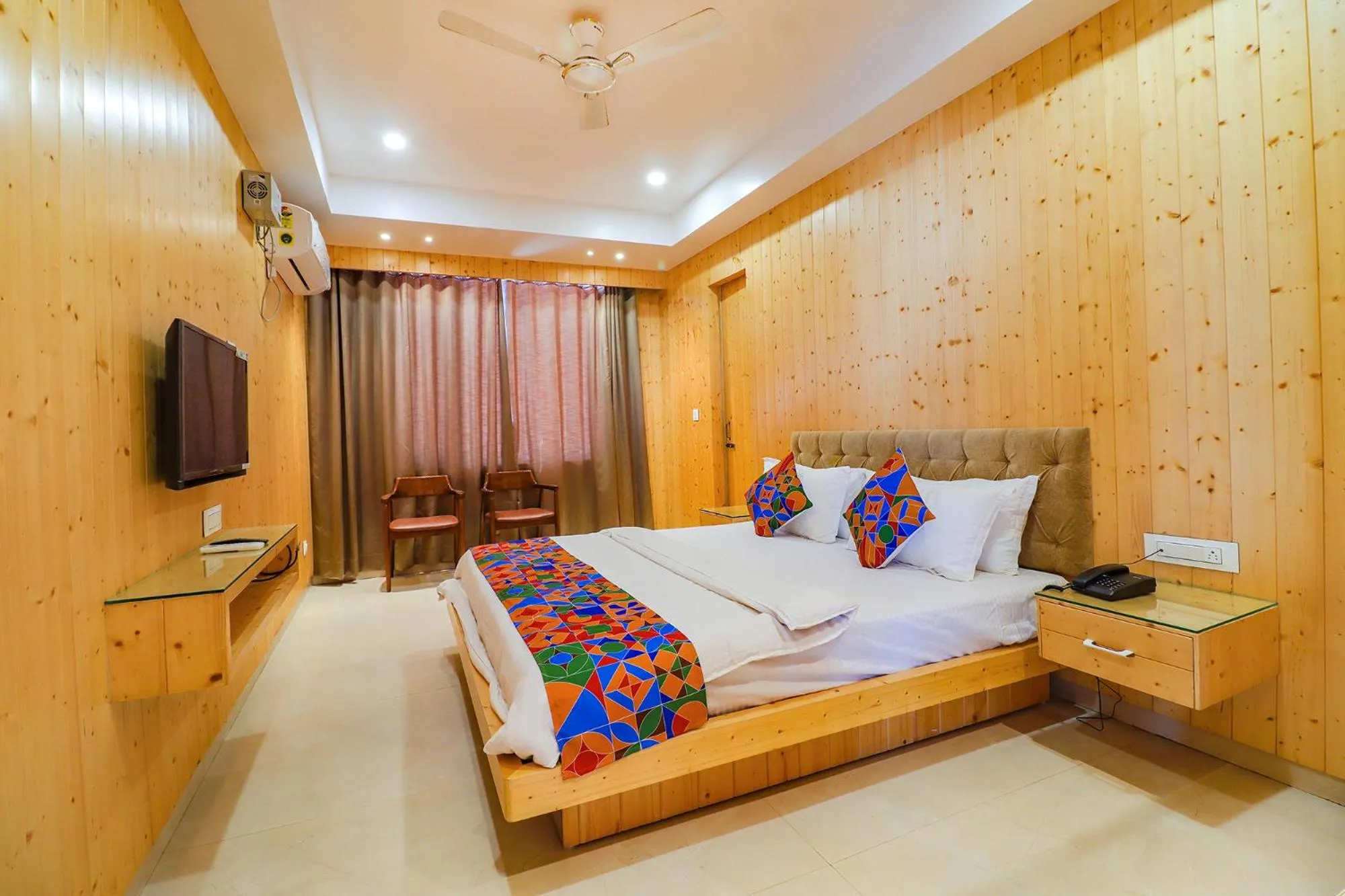 Bed in FabHotel Grand Arya