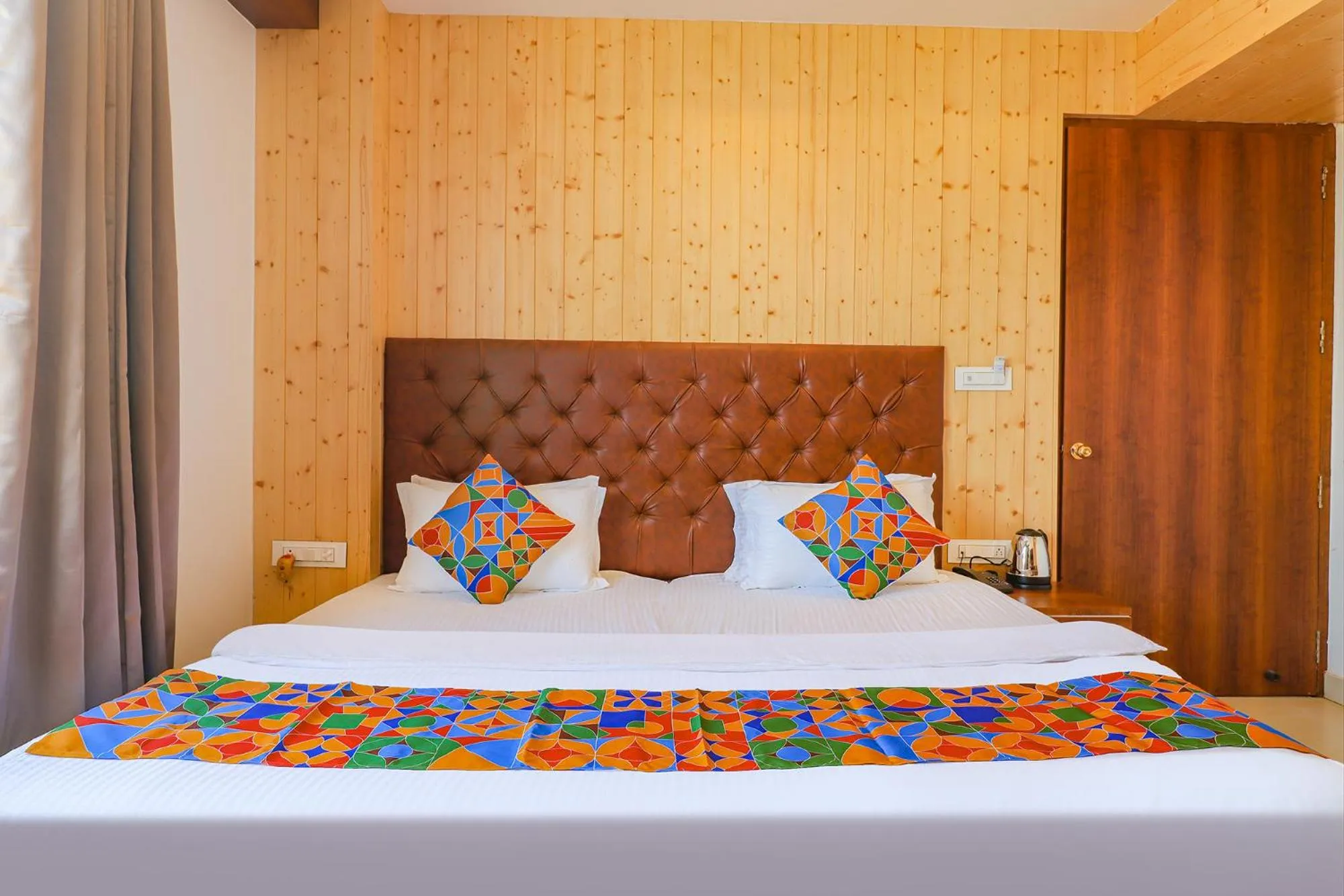 Bed in FabHotel Grand Arya
