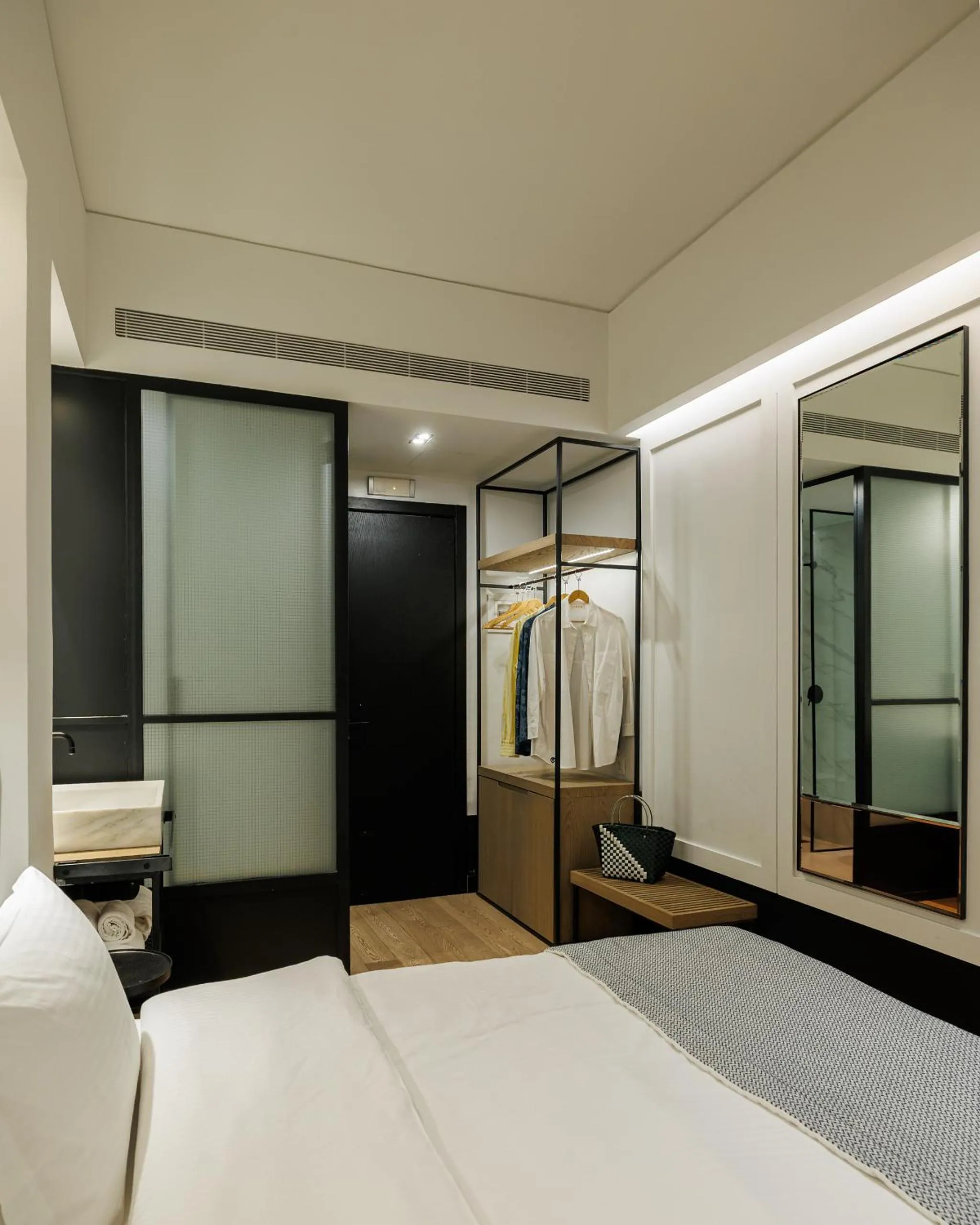 Bed in Niki Athens Hotel