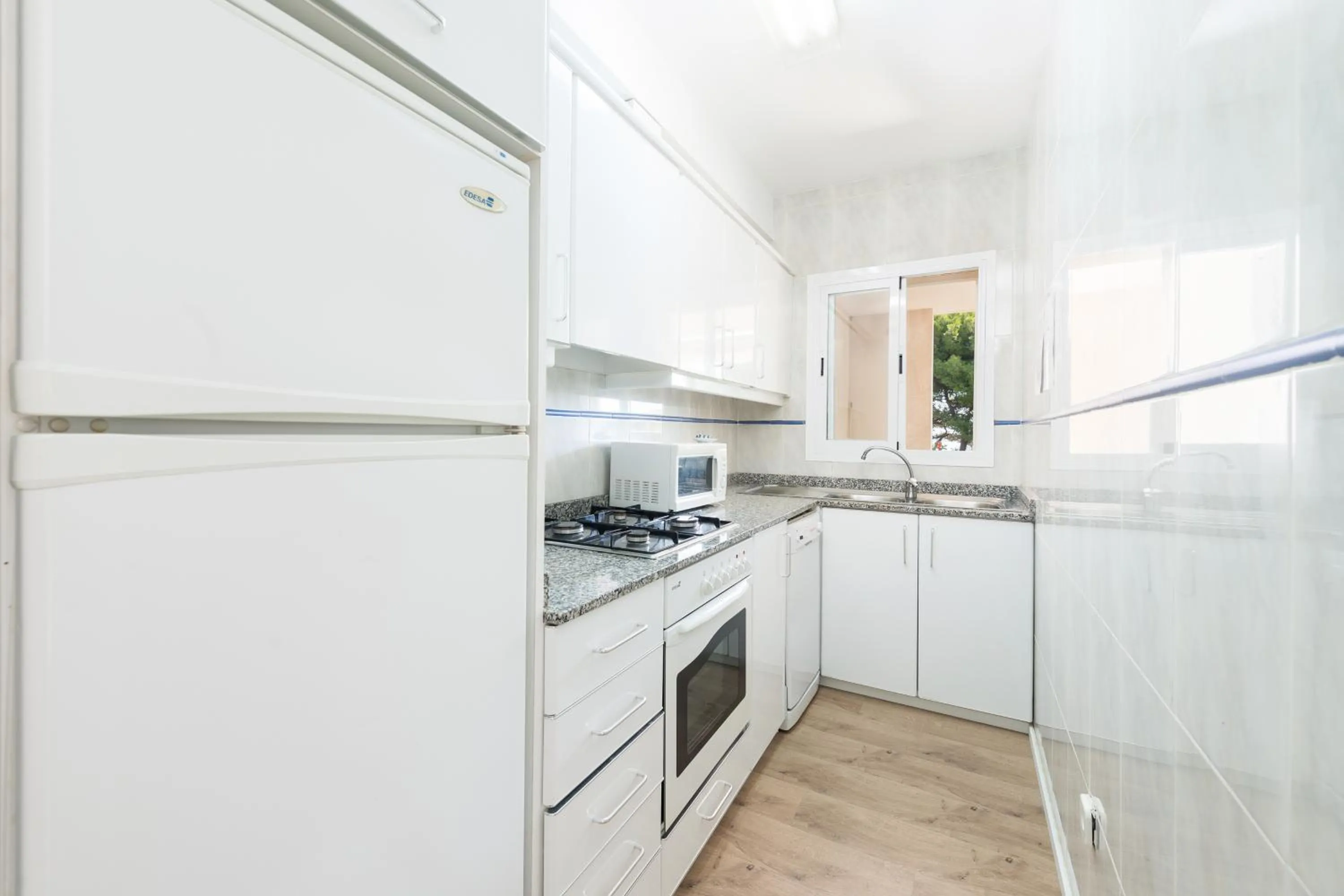 Kitchen or kitchenette in NEW! Sun of the *Beach*4 Holiday* home in Mallorca