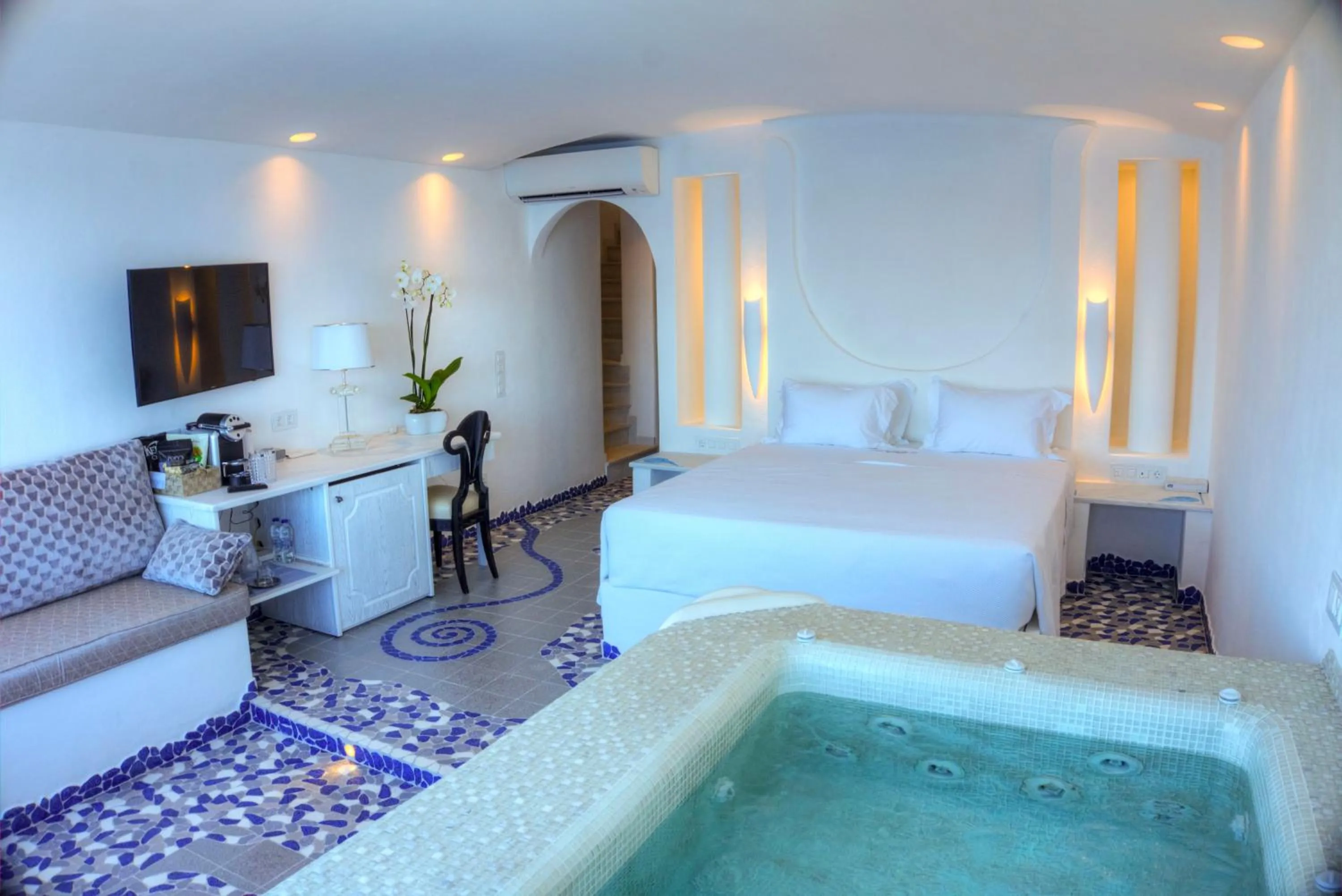 Bed in Astarte Suites