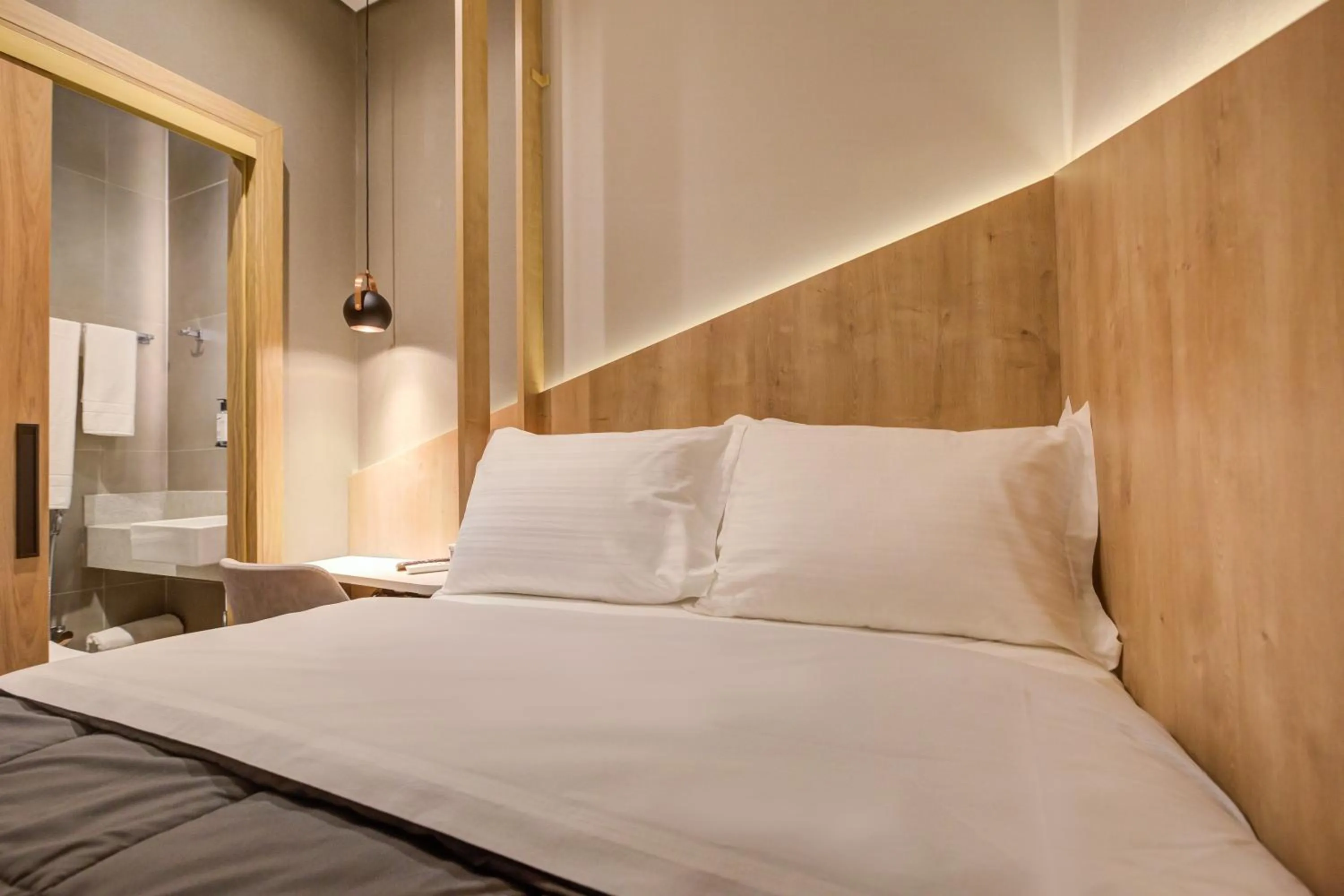 Bed in Fast Sleep Suites by Slaviero Hoteis - Hotel dentro do Aeroporto de Guarulhos - Terminal 2 - desembarque oeste