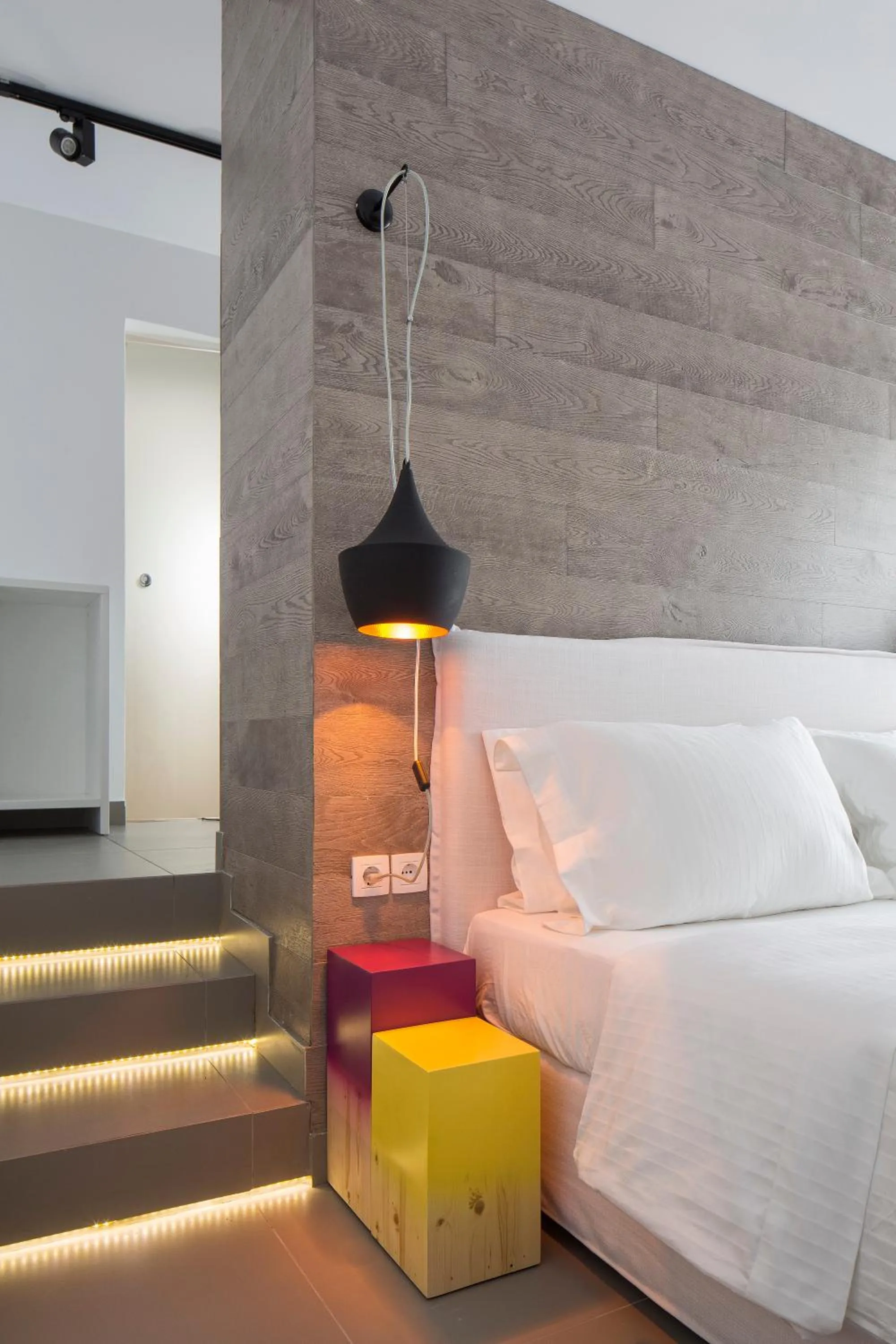 Bed in Loizos Stylish Residences