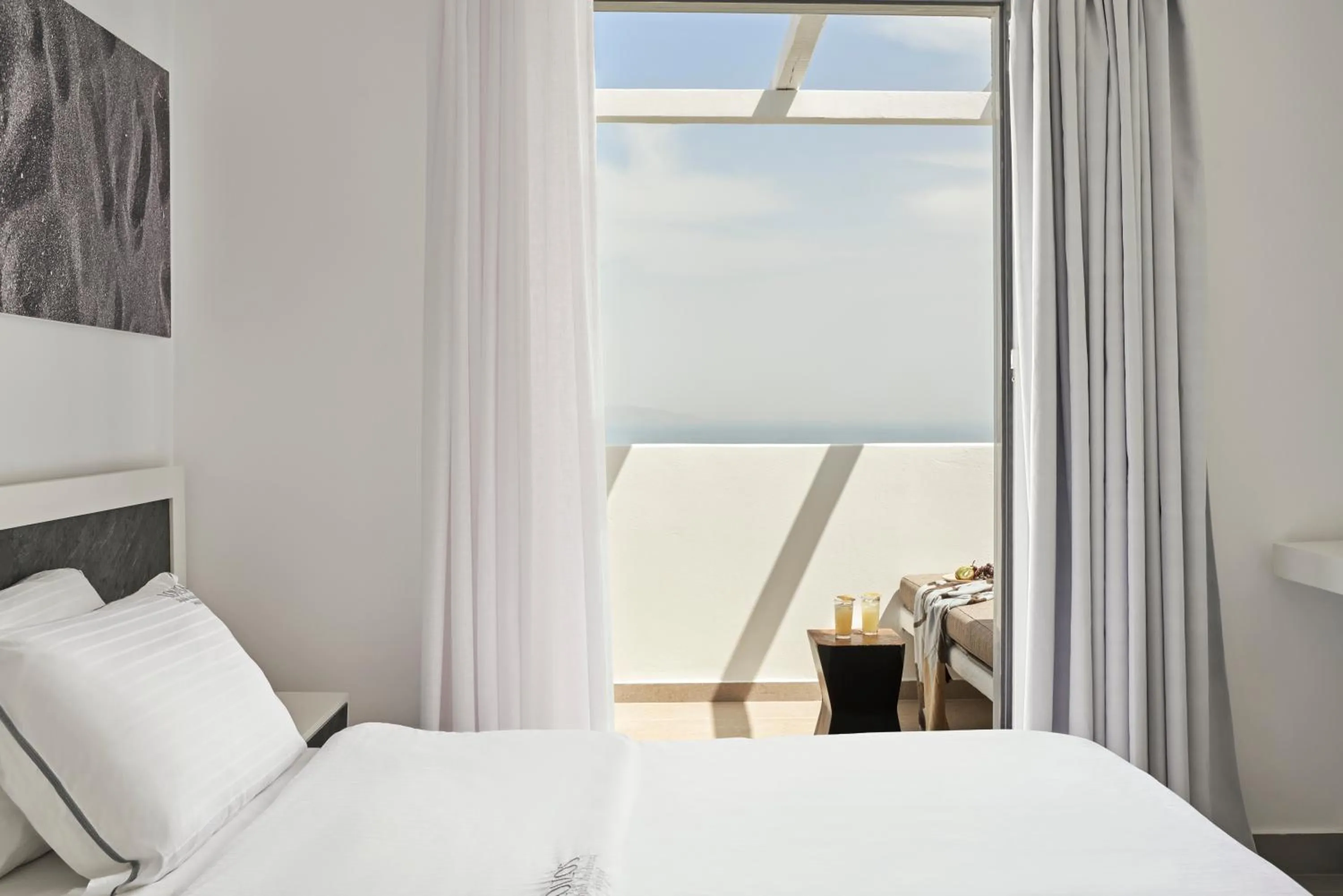 Bed in Loizos Stylish Residences