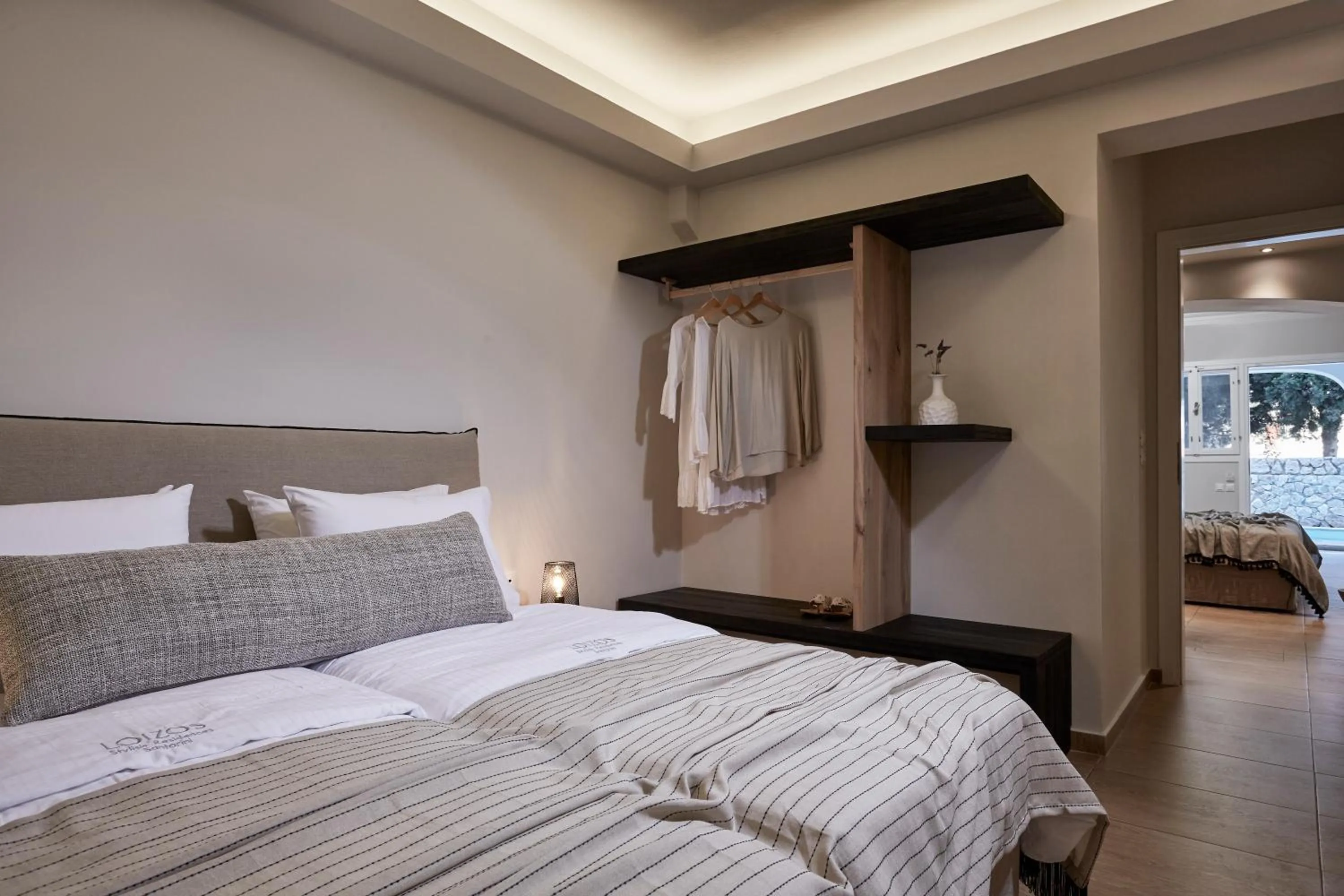 Bed in Loizos Stylish Residences