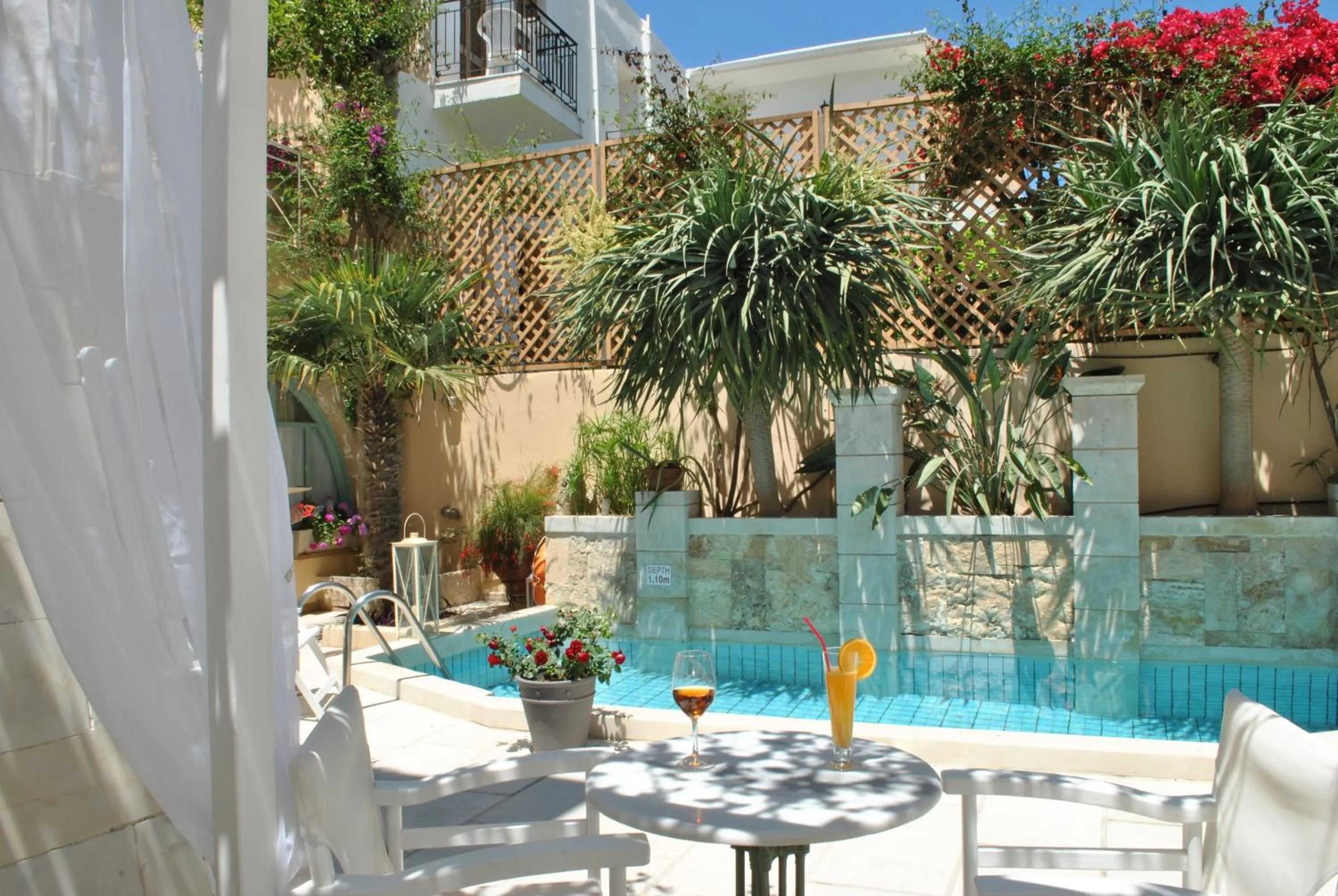 Swimming pool in Mythos Suites Boutique Hotel