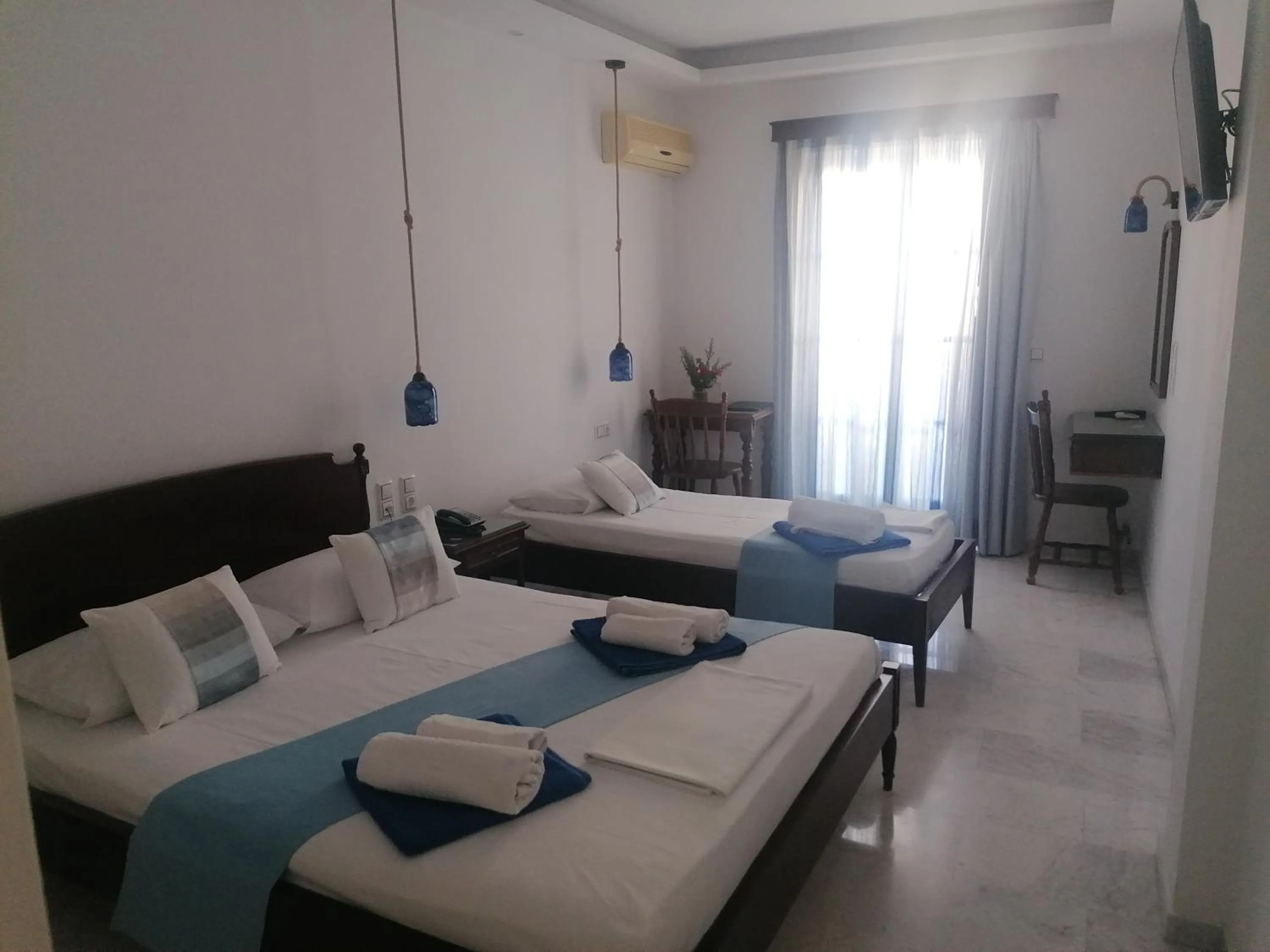 Bed in Adonis Hotel Naxos