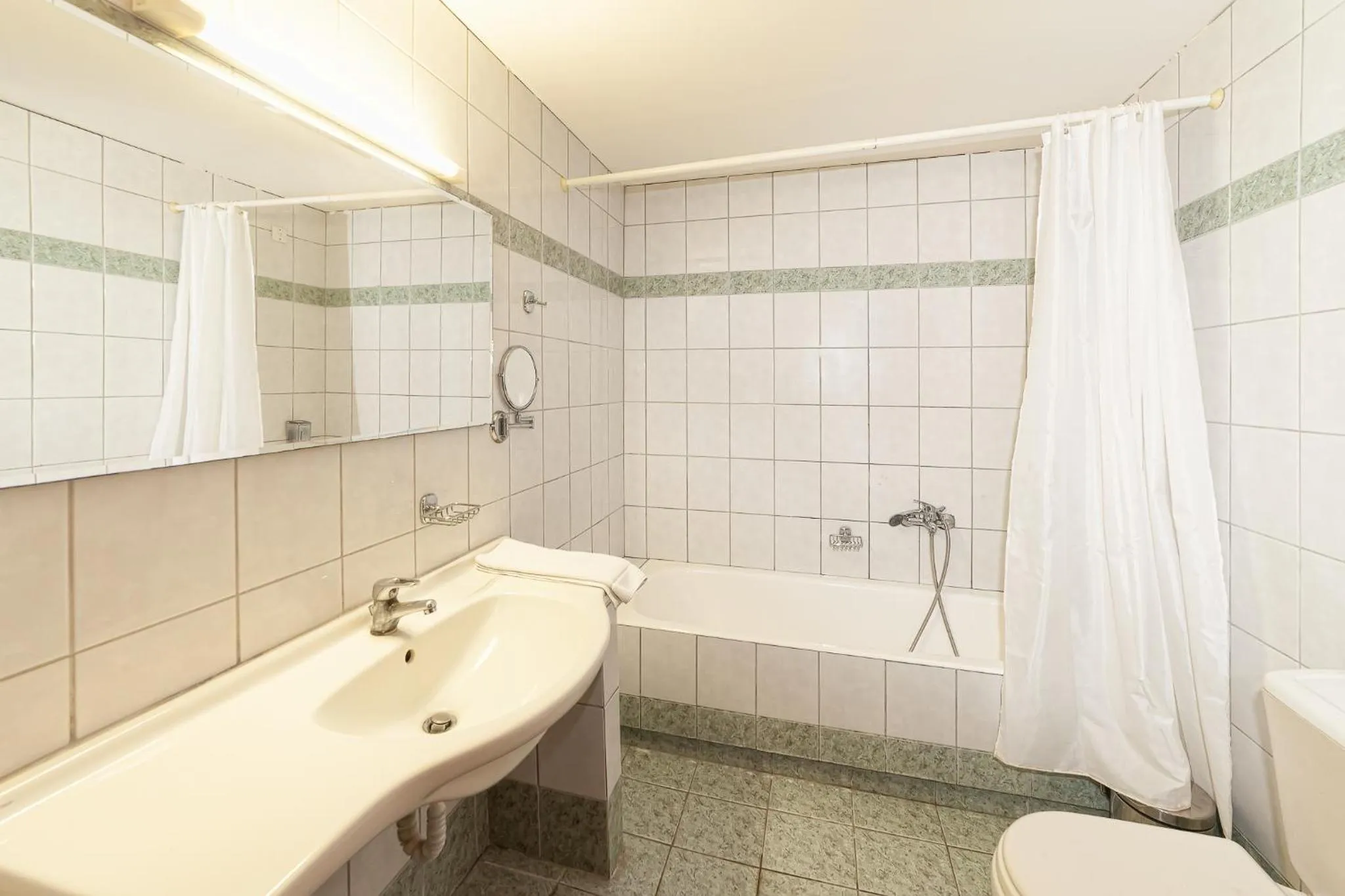 Toilet in Olympic Suites