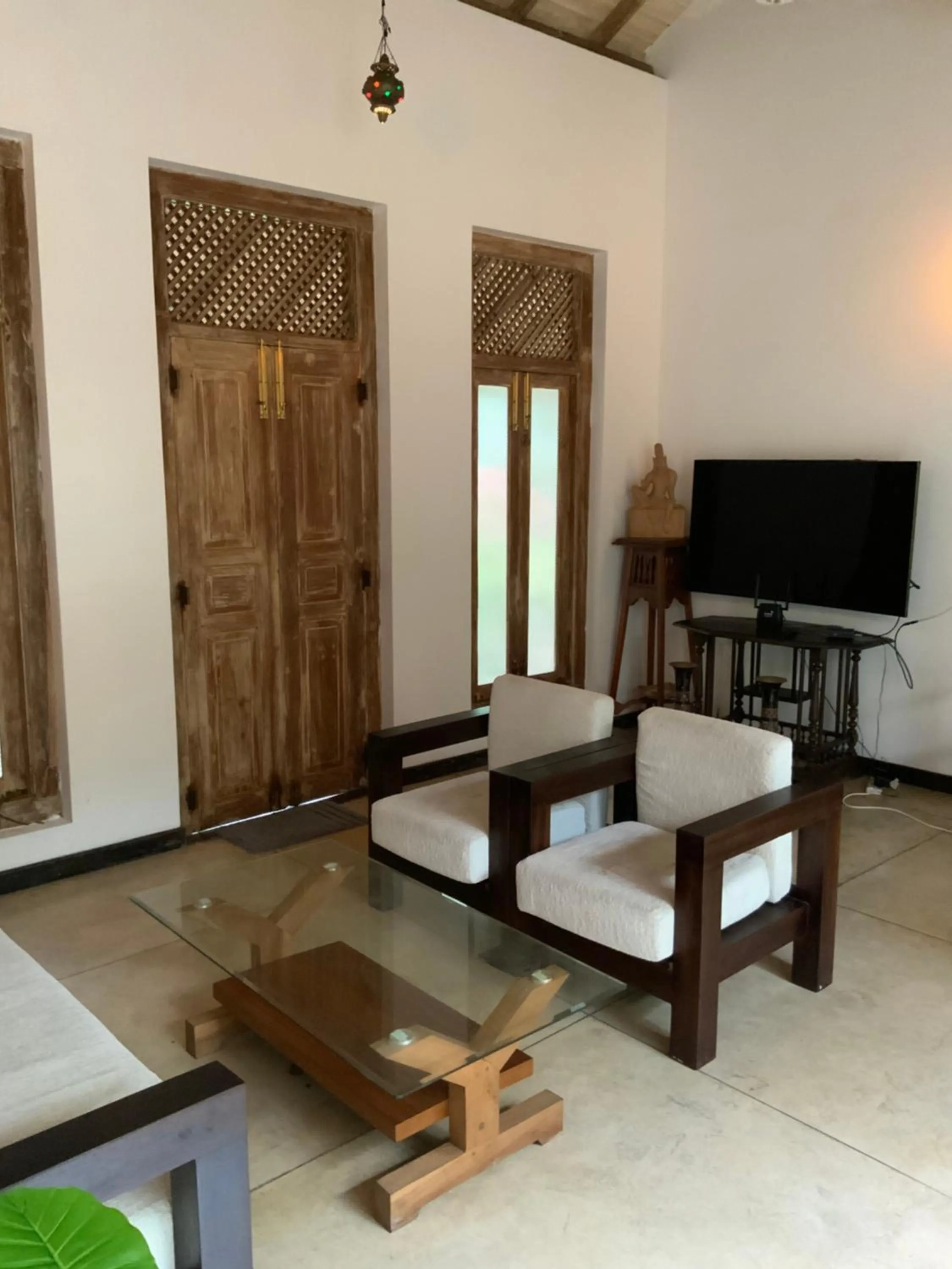 Communal lounge/ TV room in Lali Villa & Fruit Garden