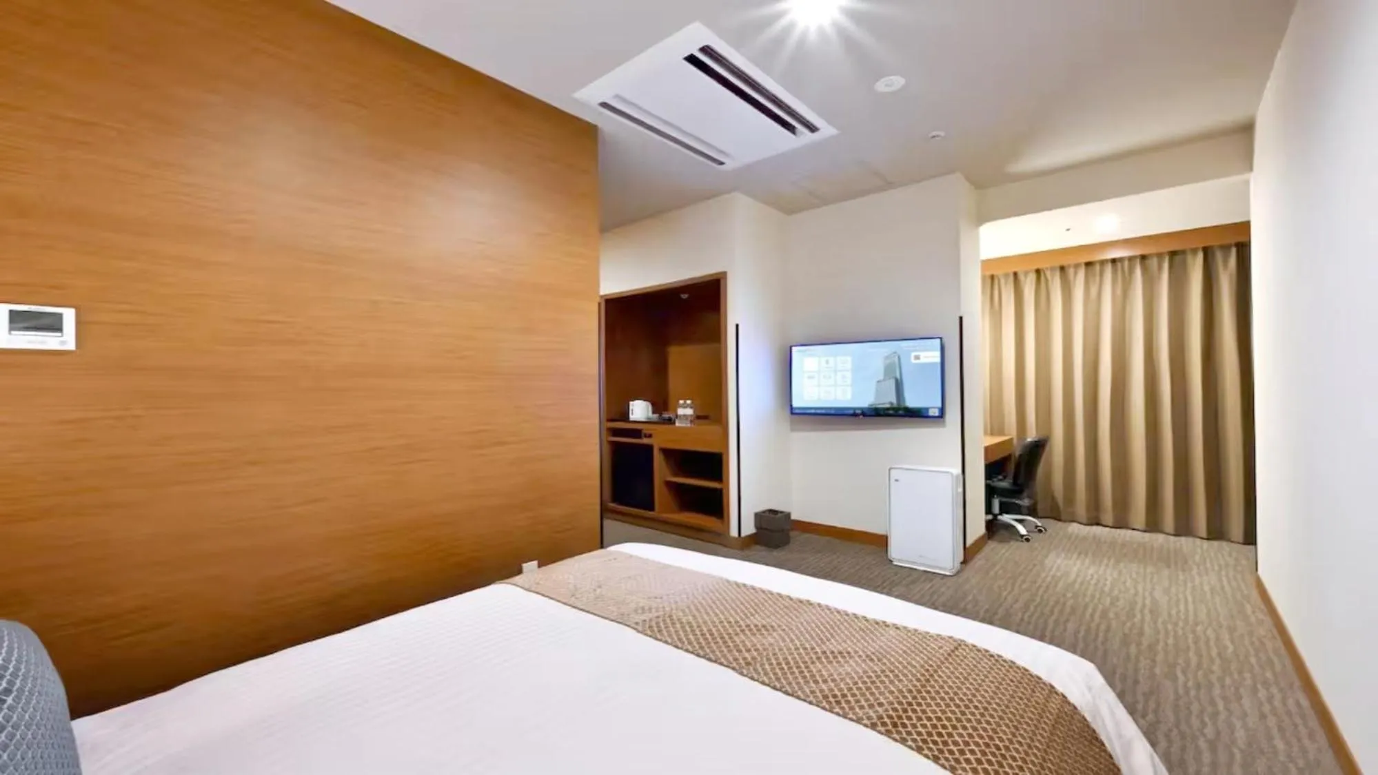 Photo of the whole room, Bed in Odysis Suites Osaka Airport Hotel