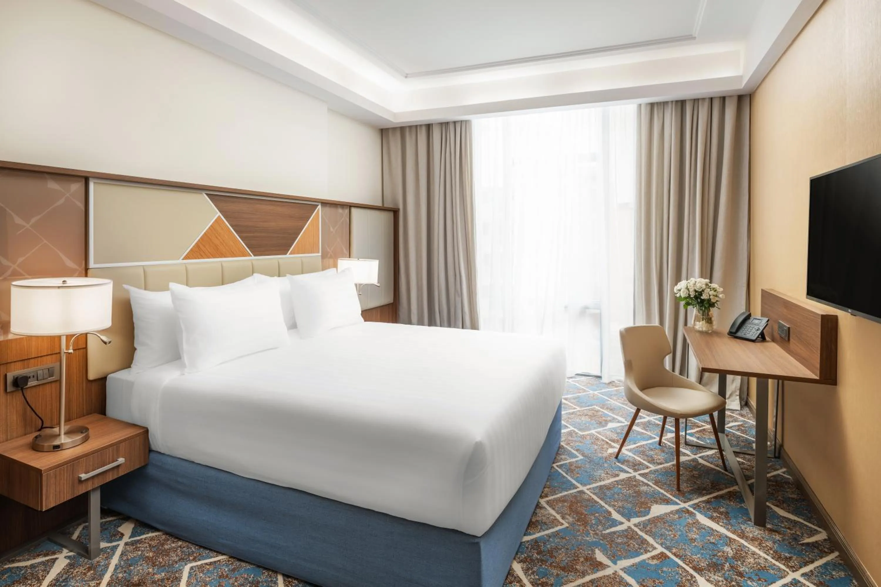 Bed in Three Pearls Musalli Hotel