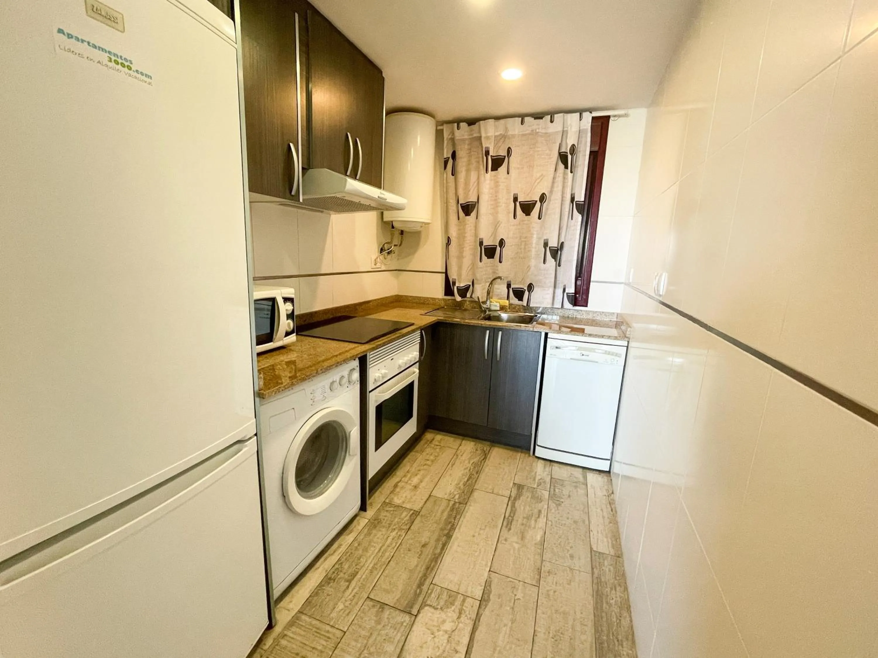 Kitchen or kitchenette in Apartamentos Mirador del Castillo 3000