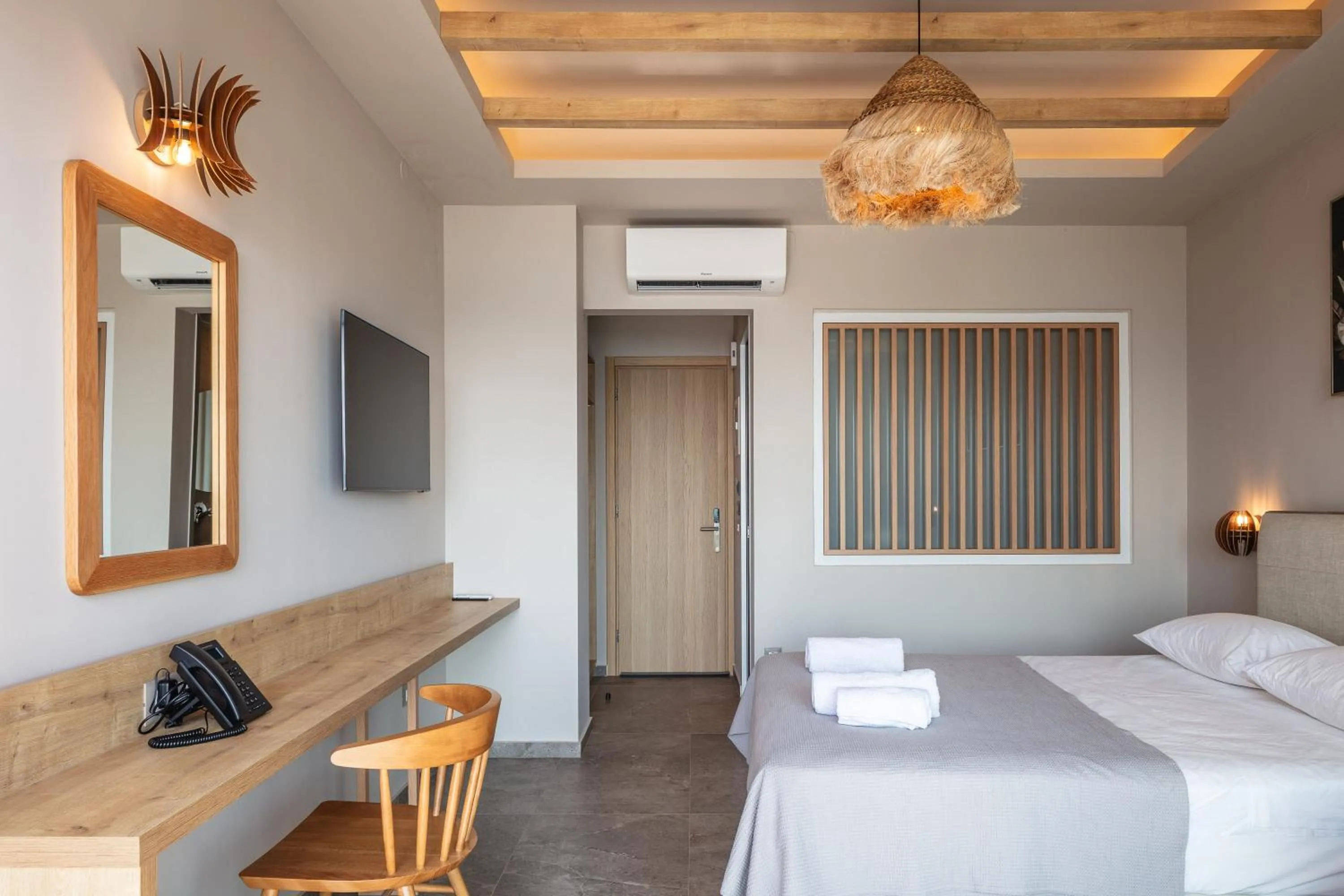 Bed in Skipper Beachfront Suites