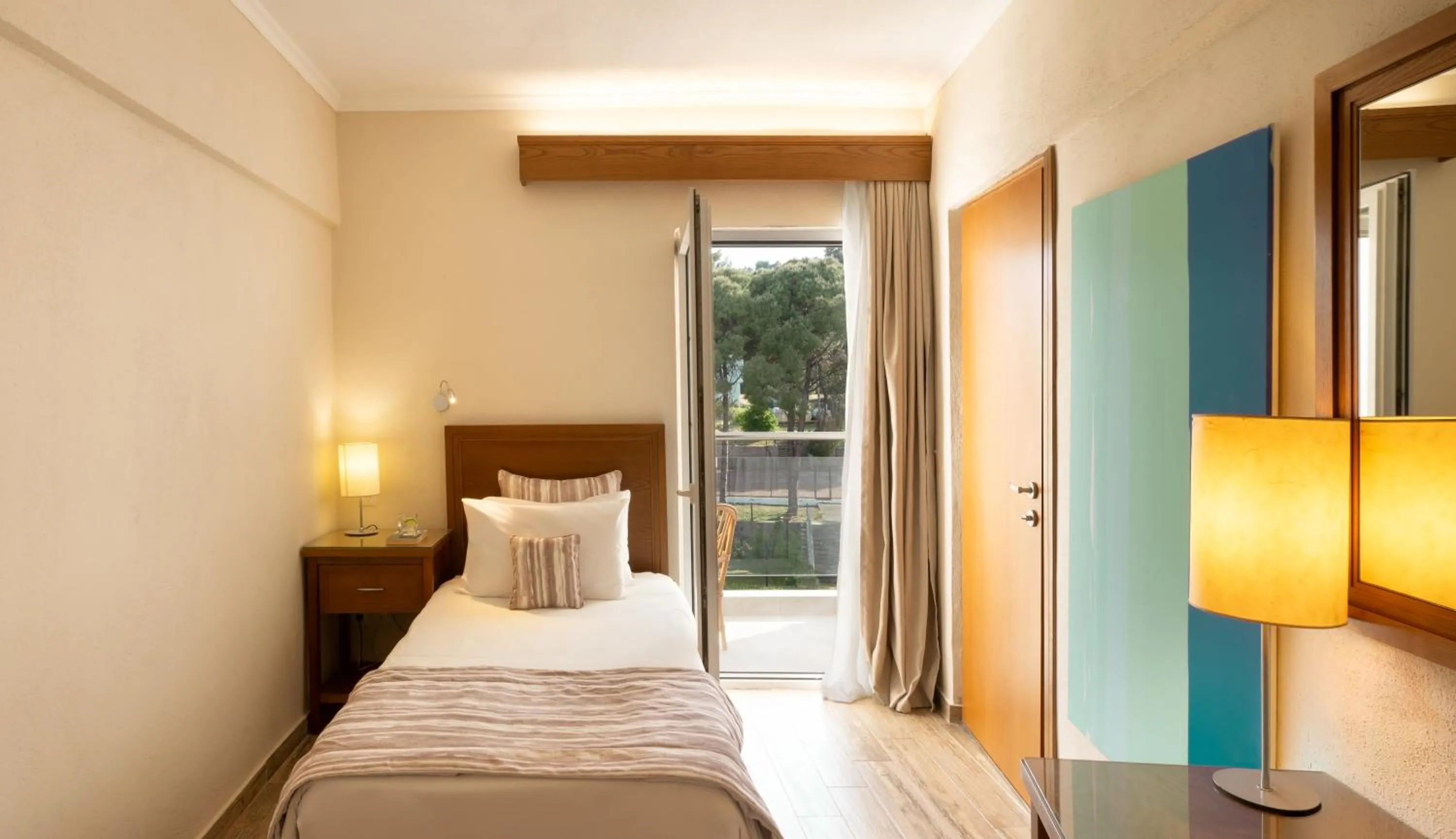 Bed in Mitsis Alexander the Great Hotel