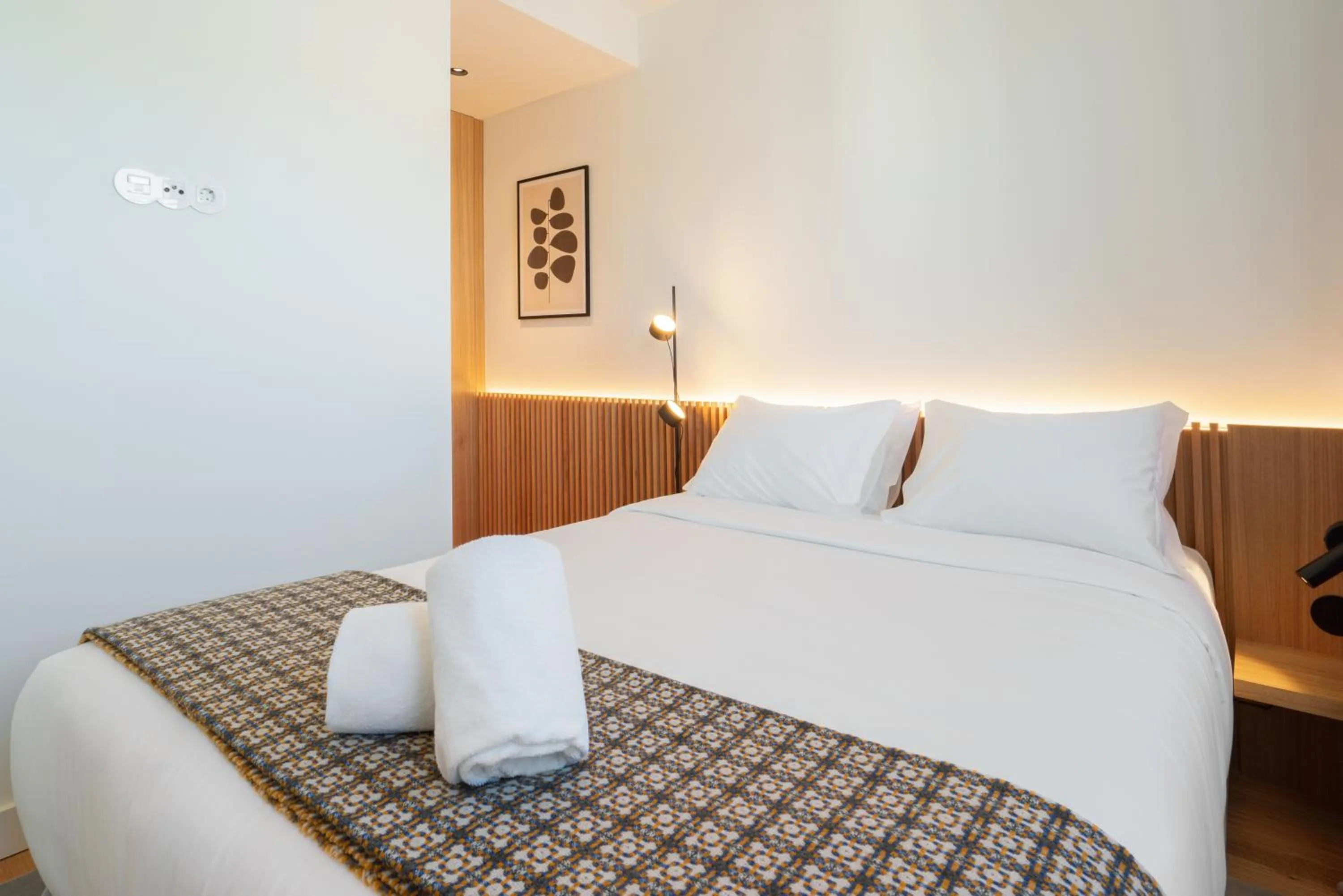 Bed in d'ALMA Boutique Hotel