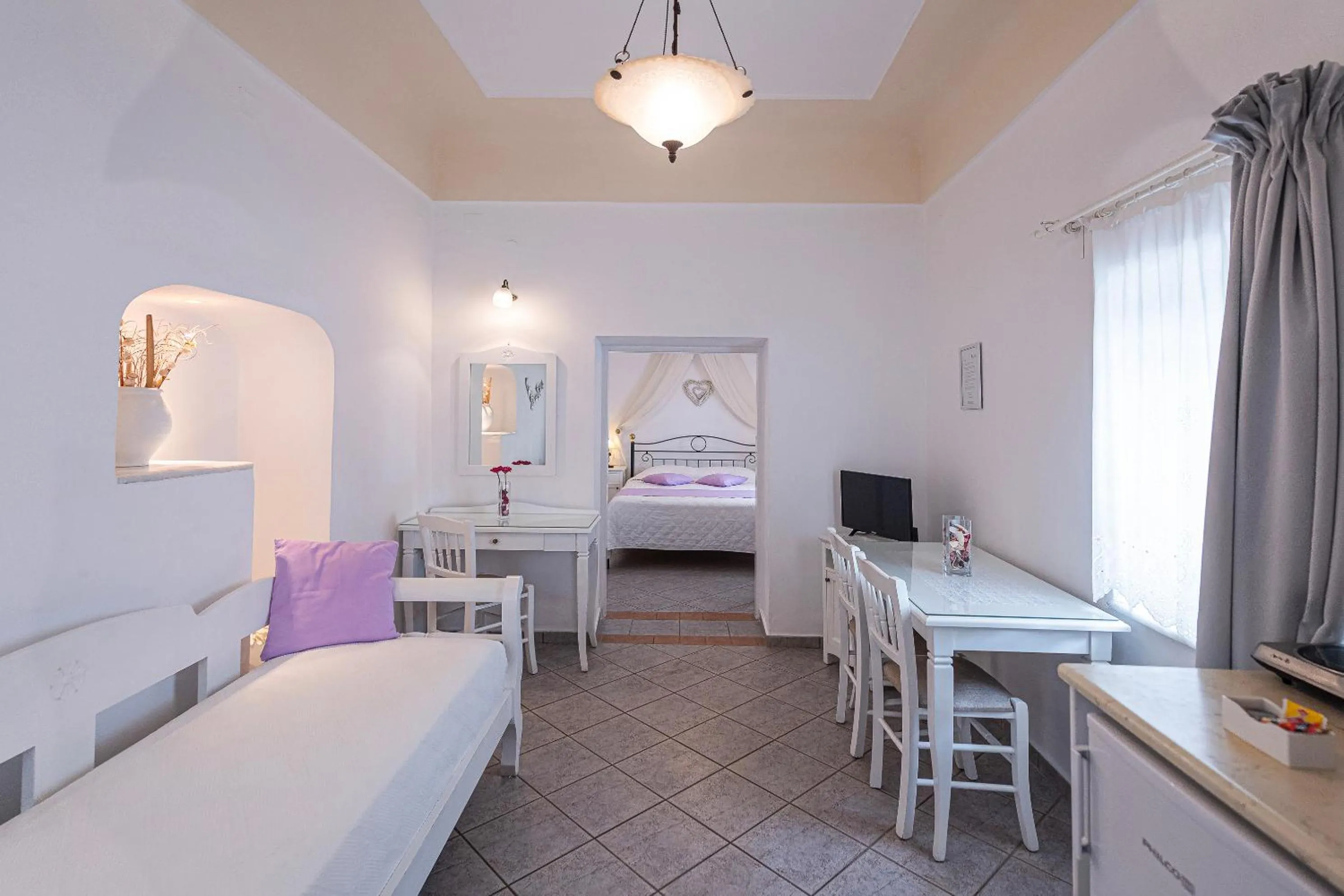 Bed in Reverie Santorini Hotel